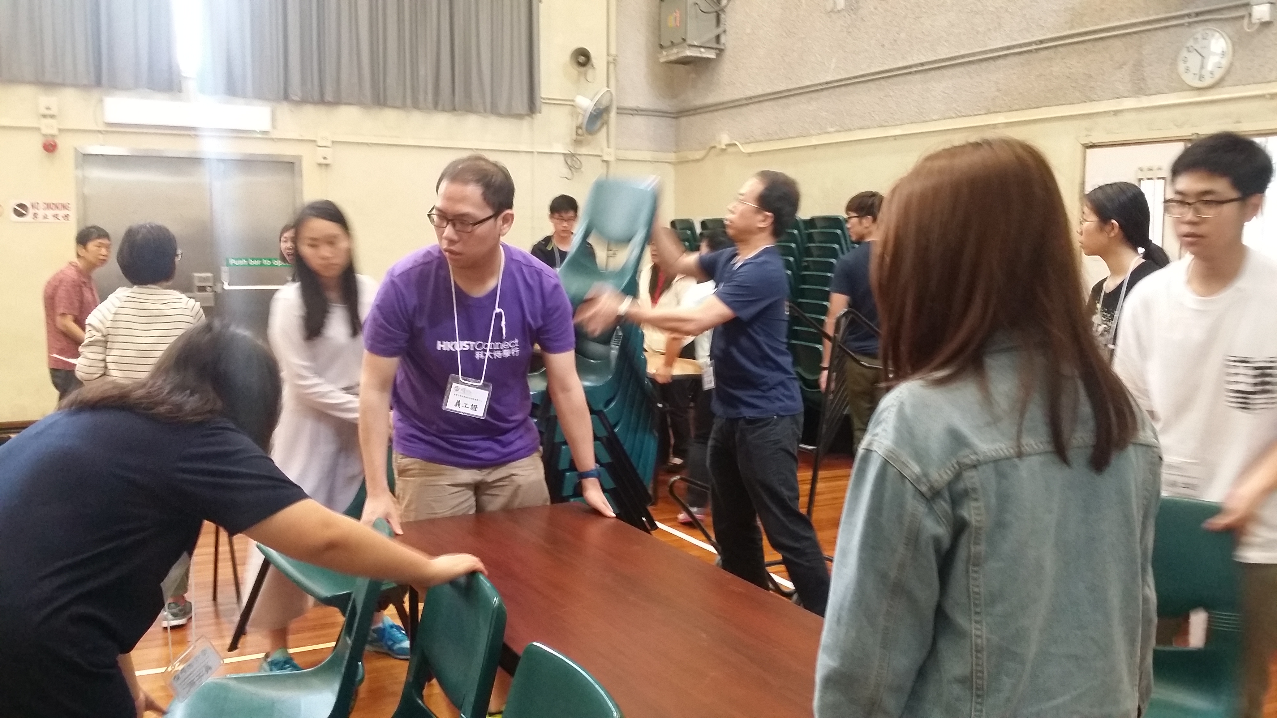Volunteers preparing tables and chairs.