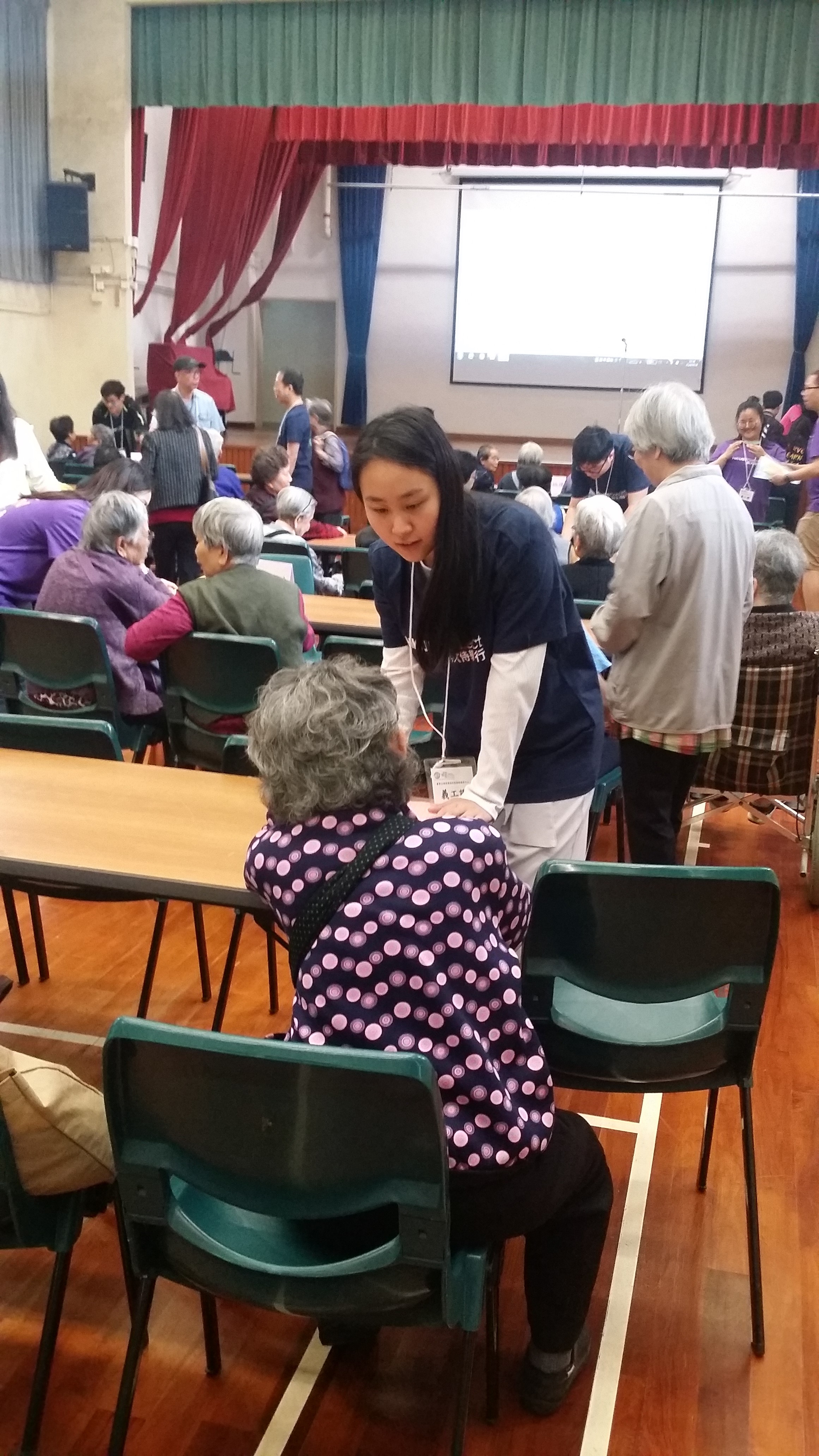Volunteers interacting with the edlerly