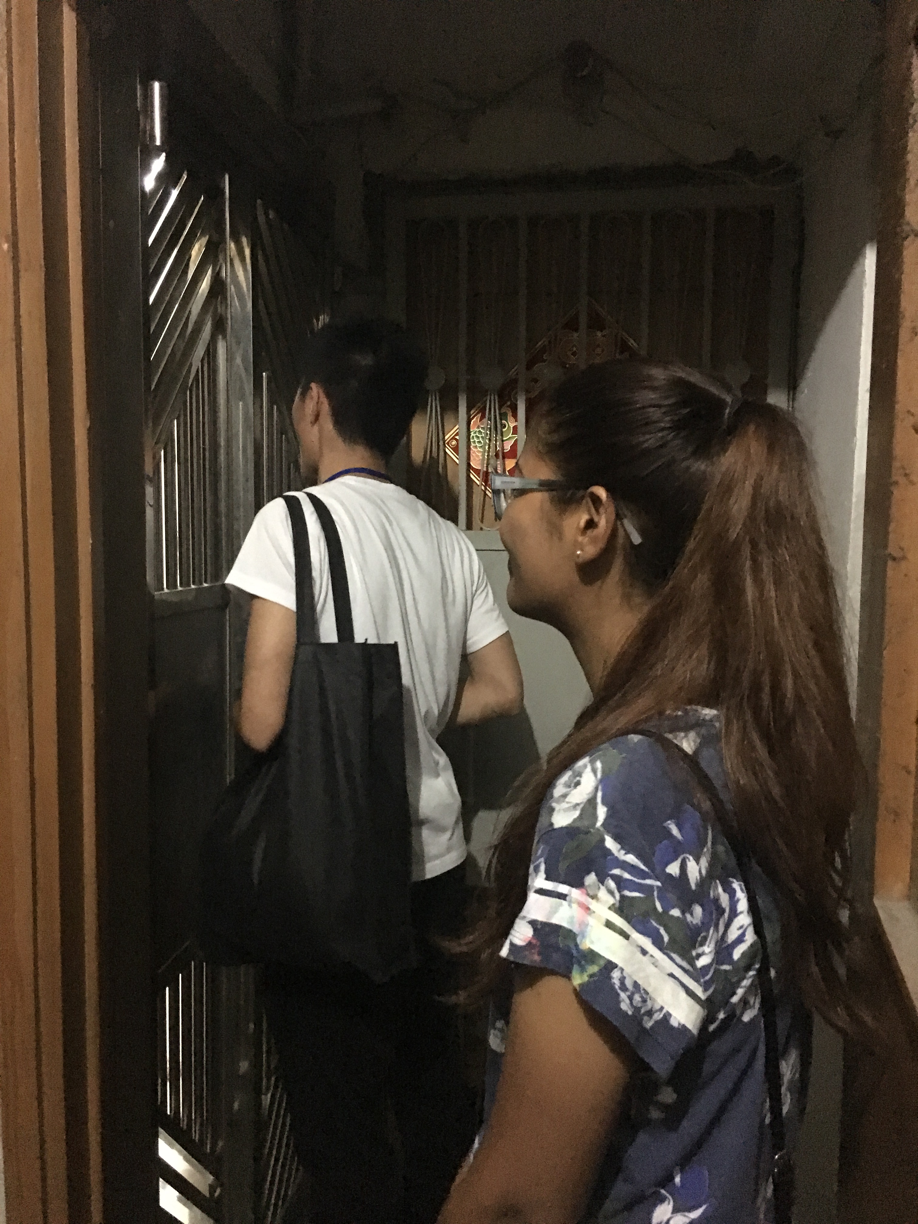 Volunteers approaching a household living in a subdivided housing unit