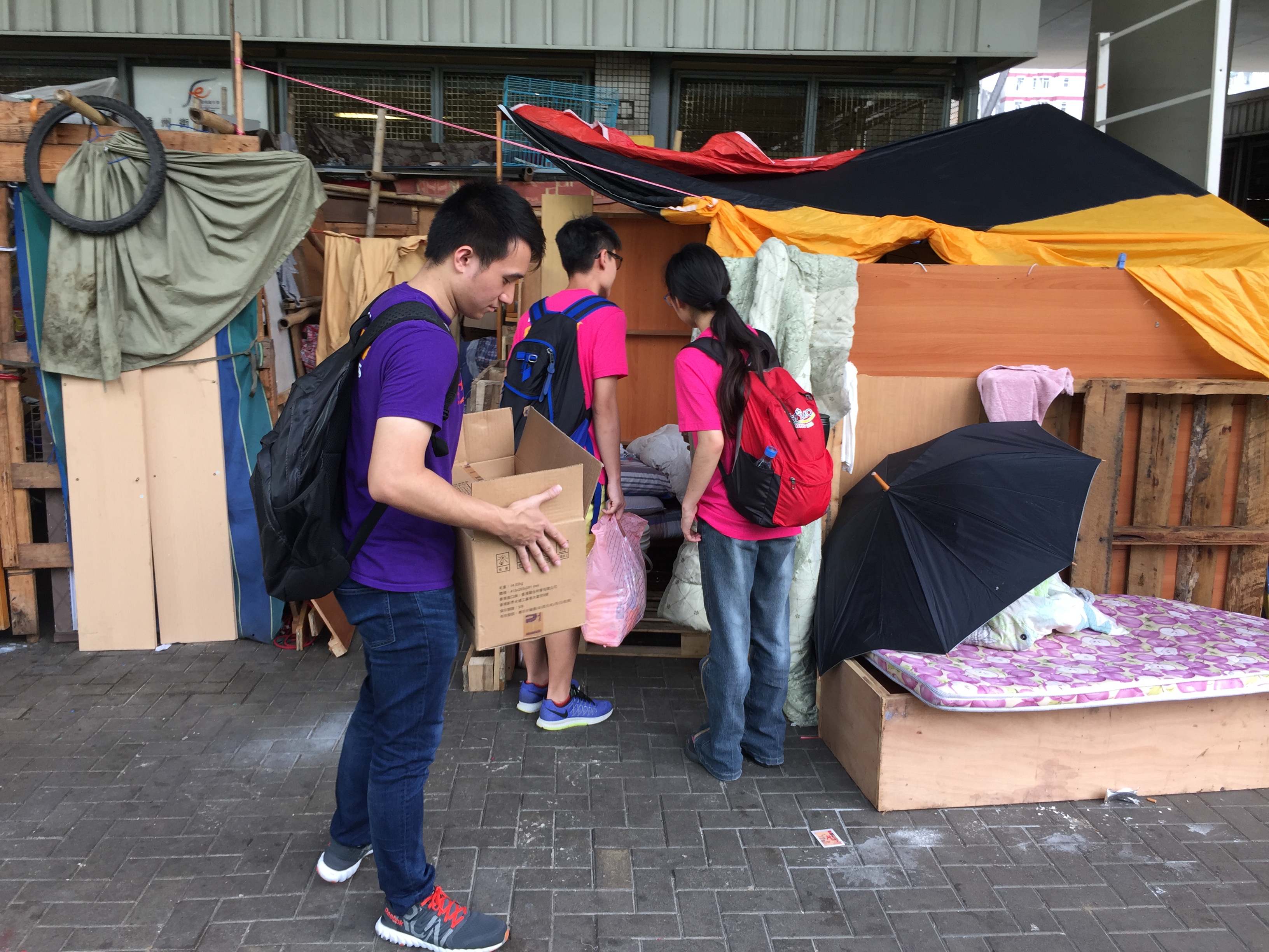 Volunteers talking to the homeless people to show them care and love