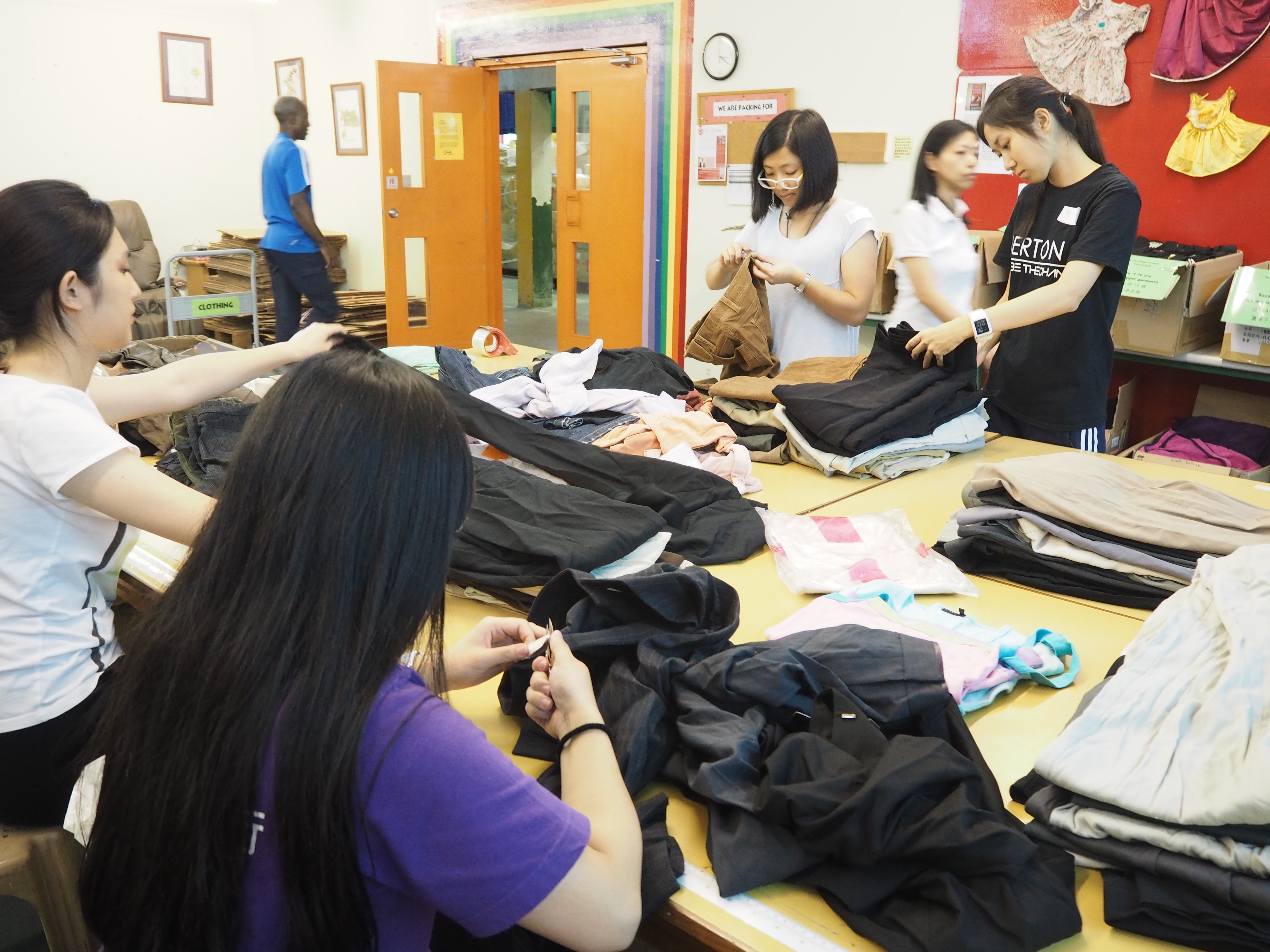 Volunteers processing the donated clothes