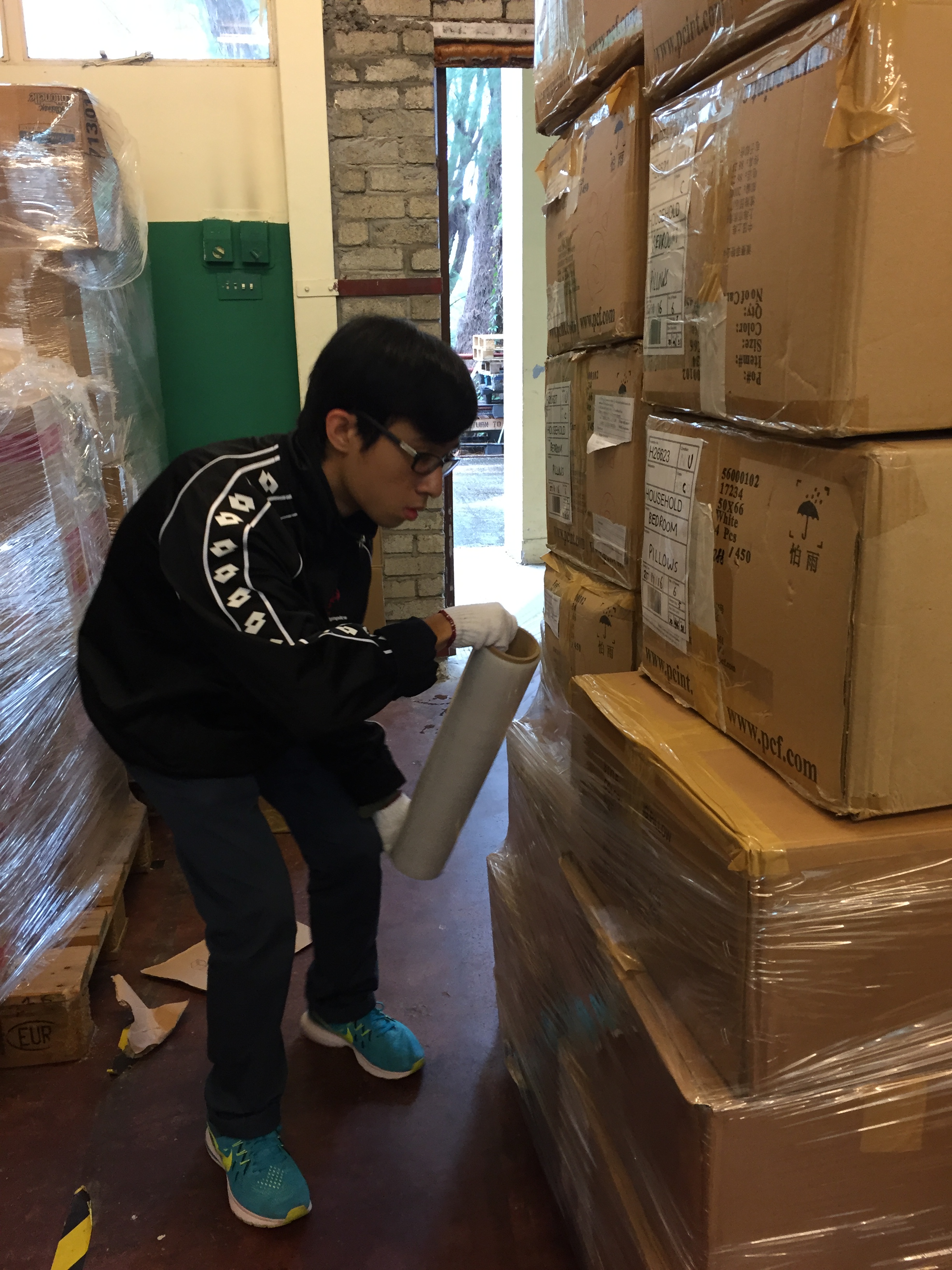 Volunteers packing the checked donated electrical appliances.