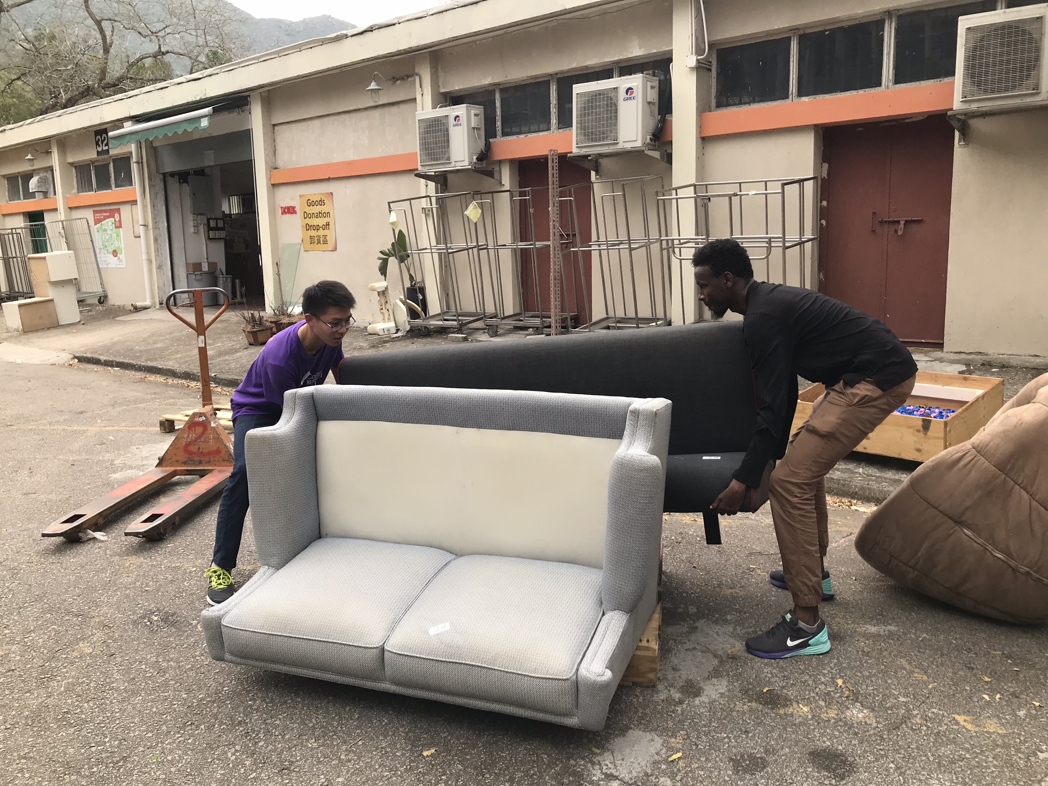 Volunteers helping with the repairing work