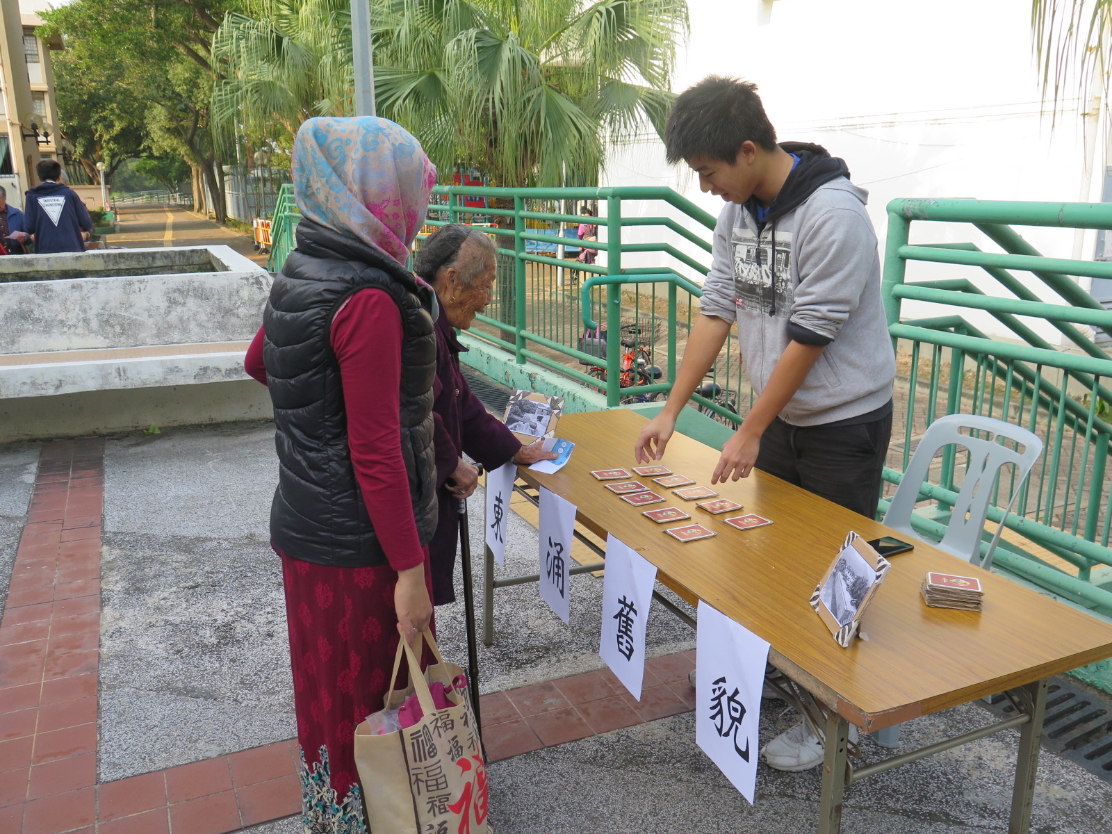 The elders enjoying games in the retro carnival