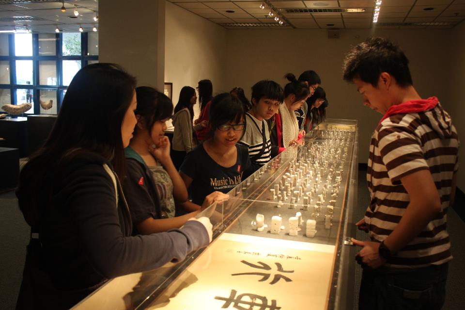 The group appreciating an exhibition in our library