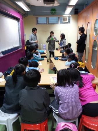 Children paying attention to the experiment demonstration