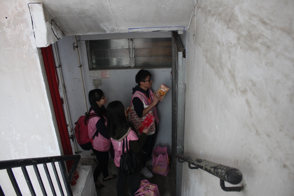 Volunteers wishing good luck for the elder with  traditional greetings