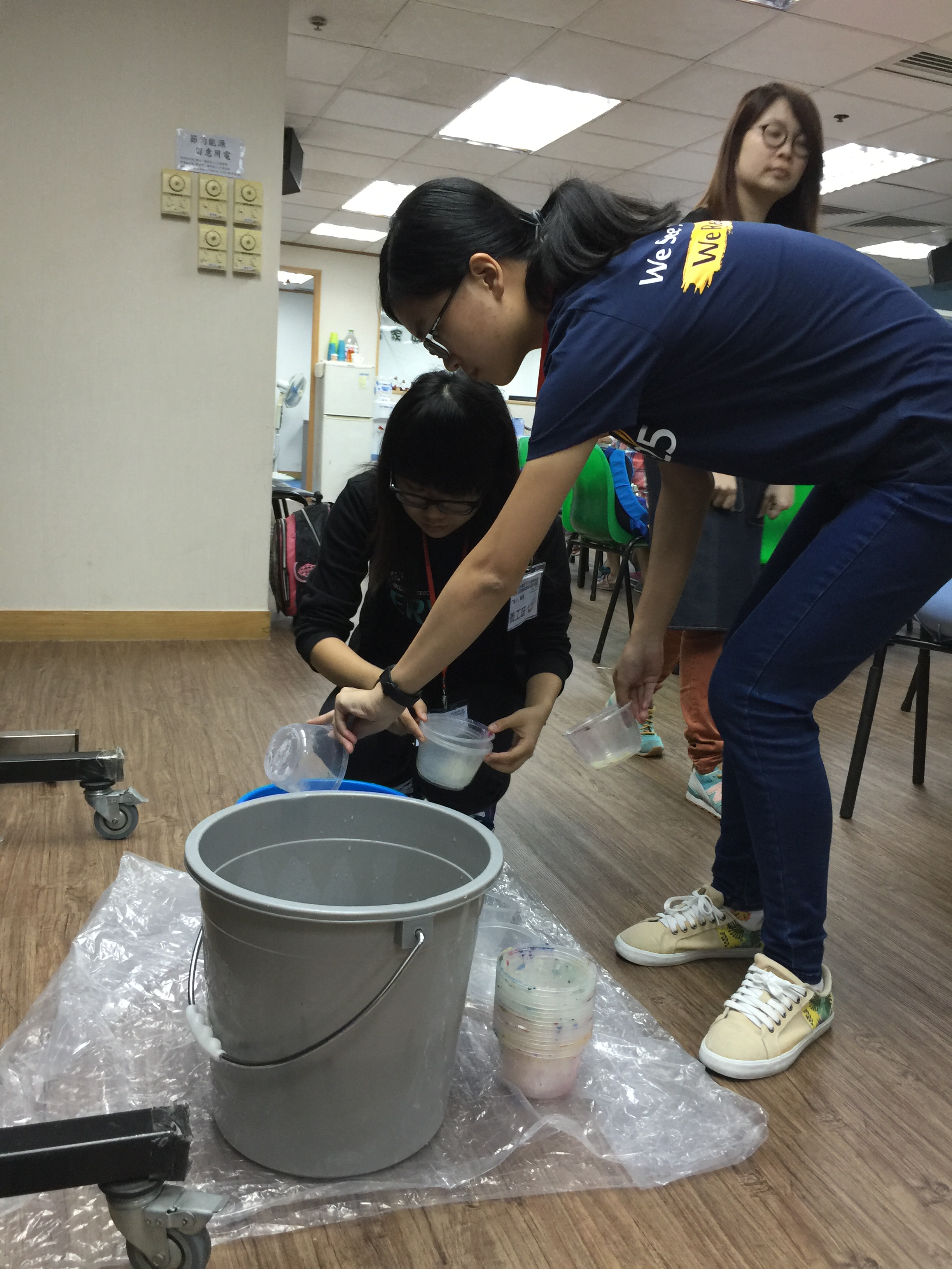 Volunteers preparing painting tools