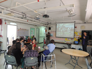 Volunteers and the elderly singing together