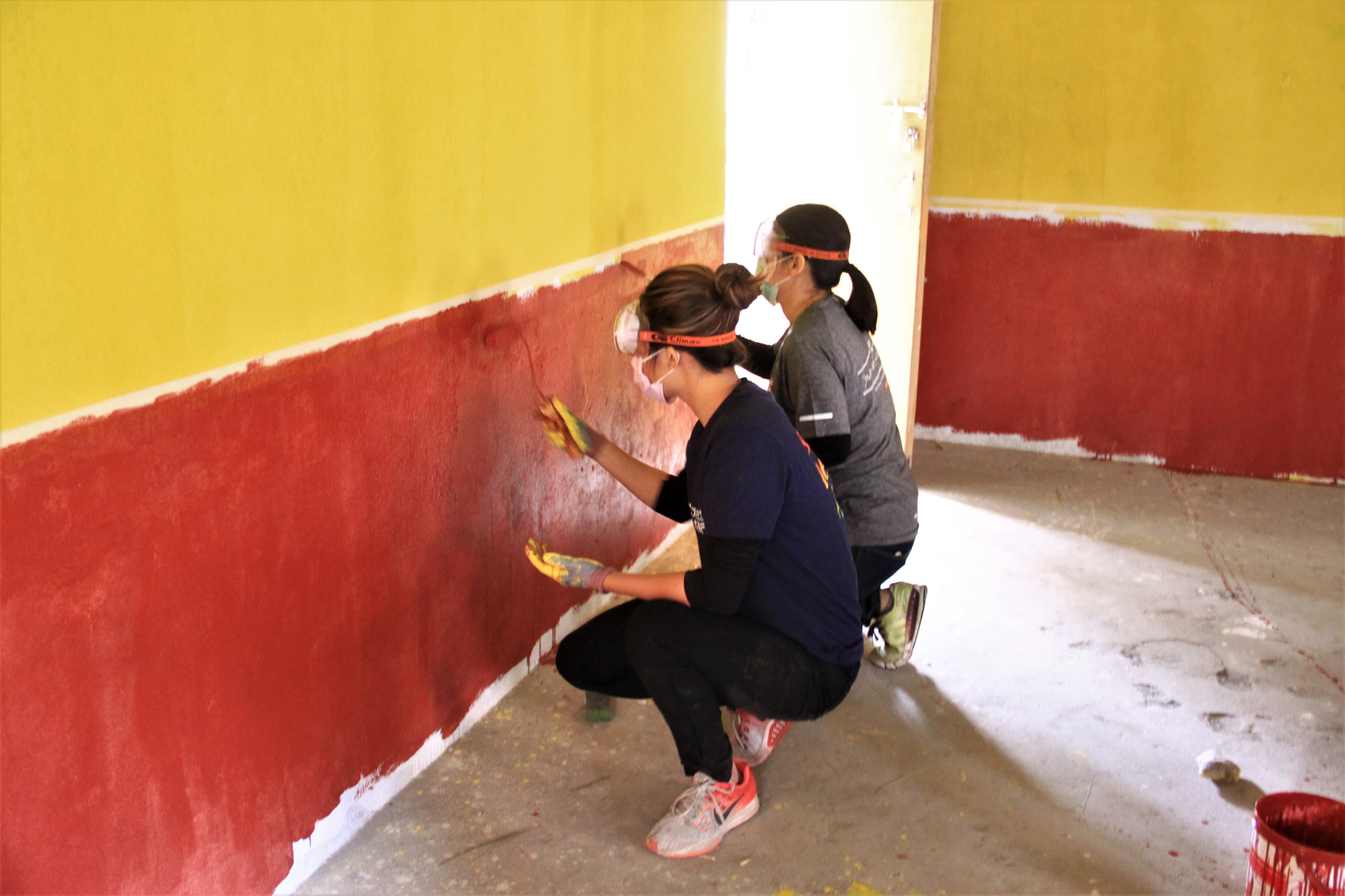 Assisting in renovating school buildings