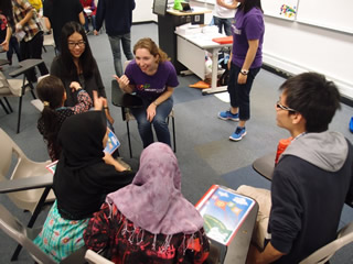 Volunteer chatting with children during the break