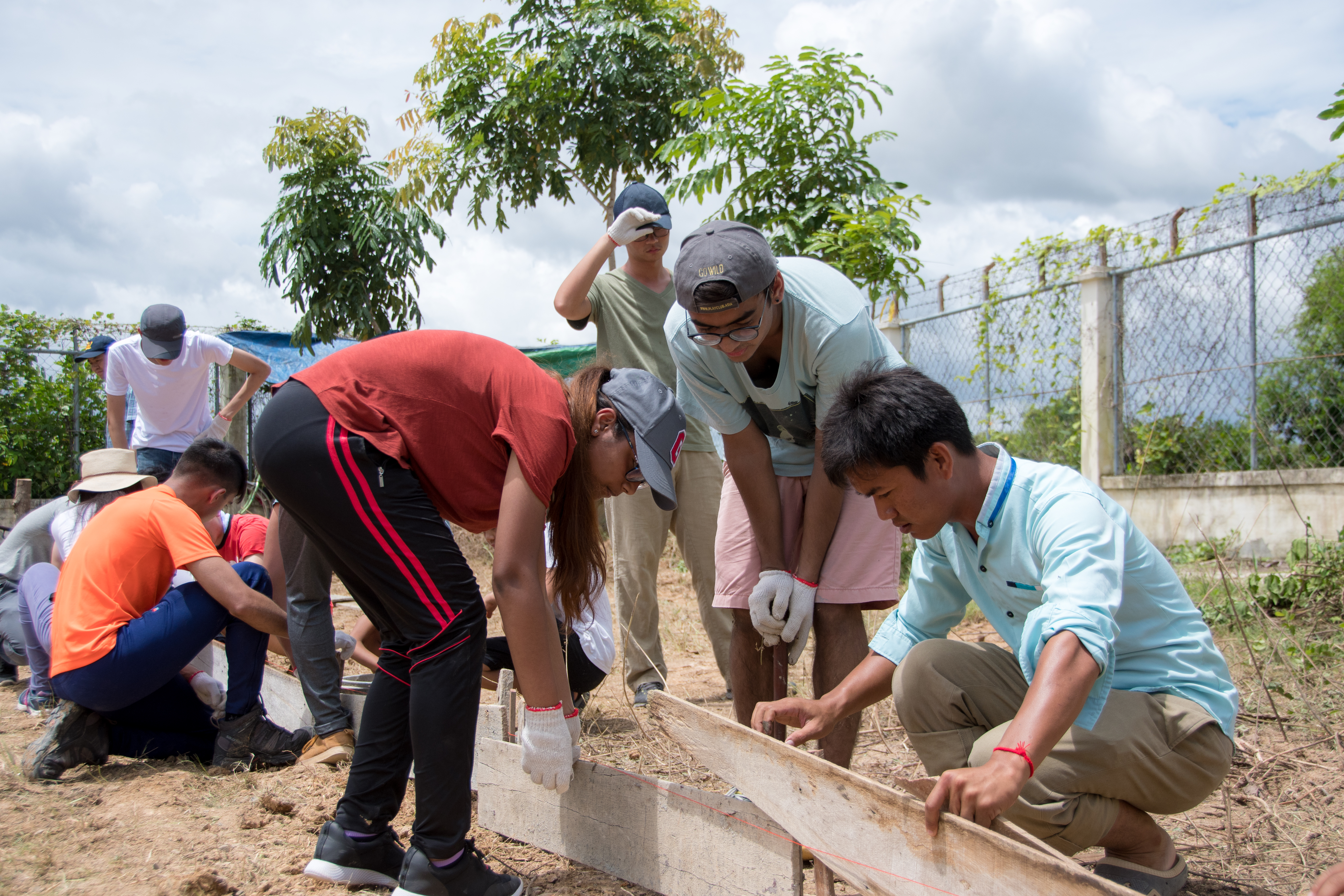 Volunteers constructing the base for solar panels