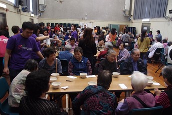 Volunteers distributing Chinese soup to the elders	