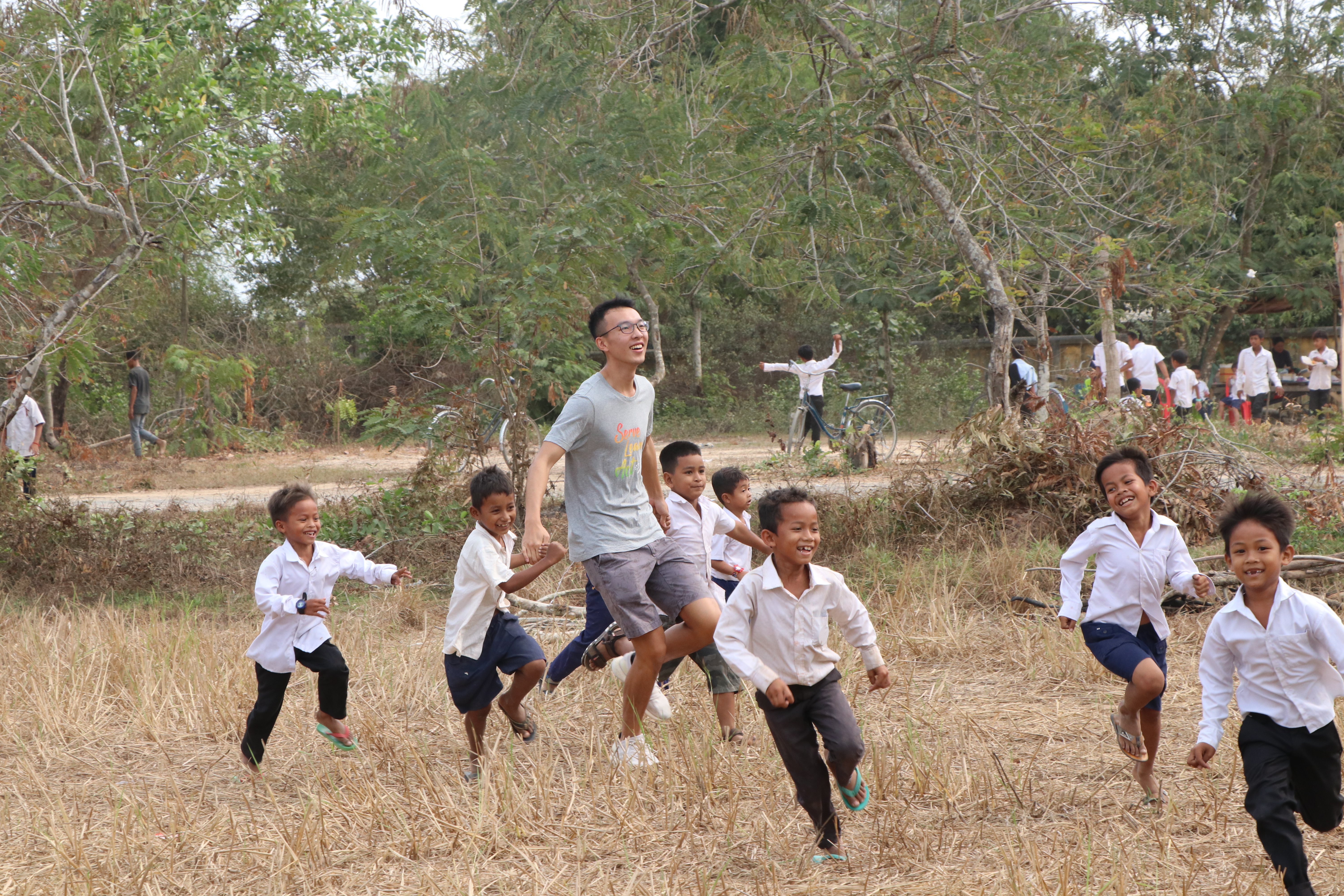 Volunteers running around with students after class