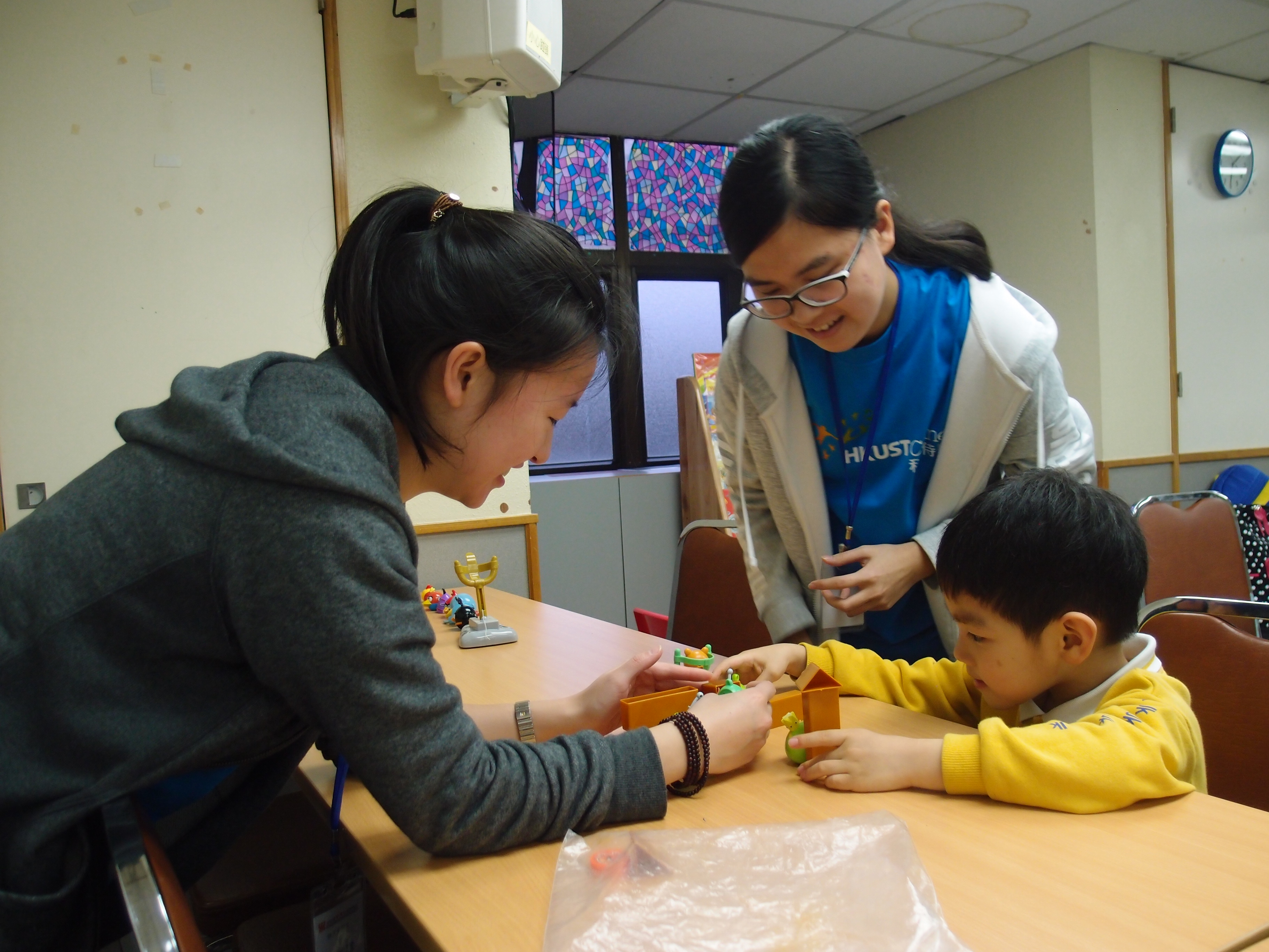 Volunteers are playing games with the child