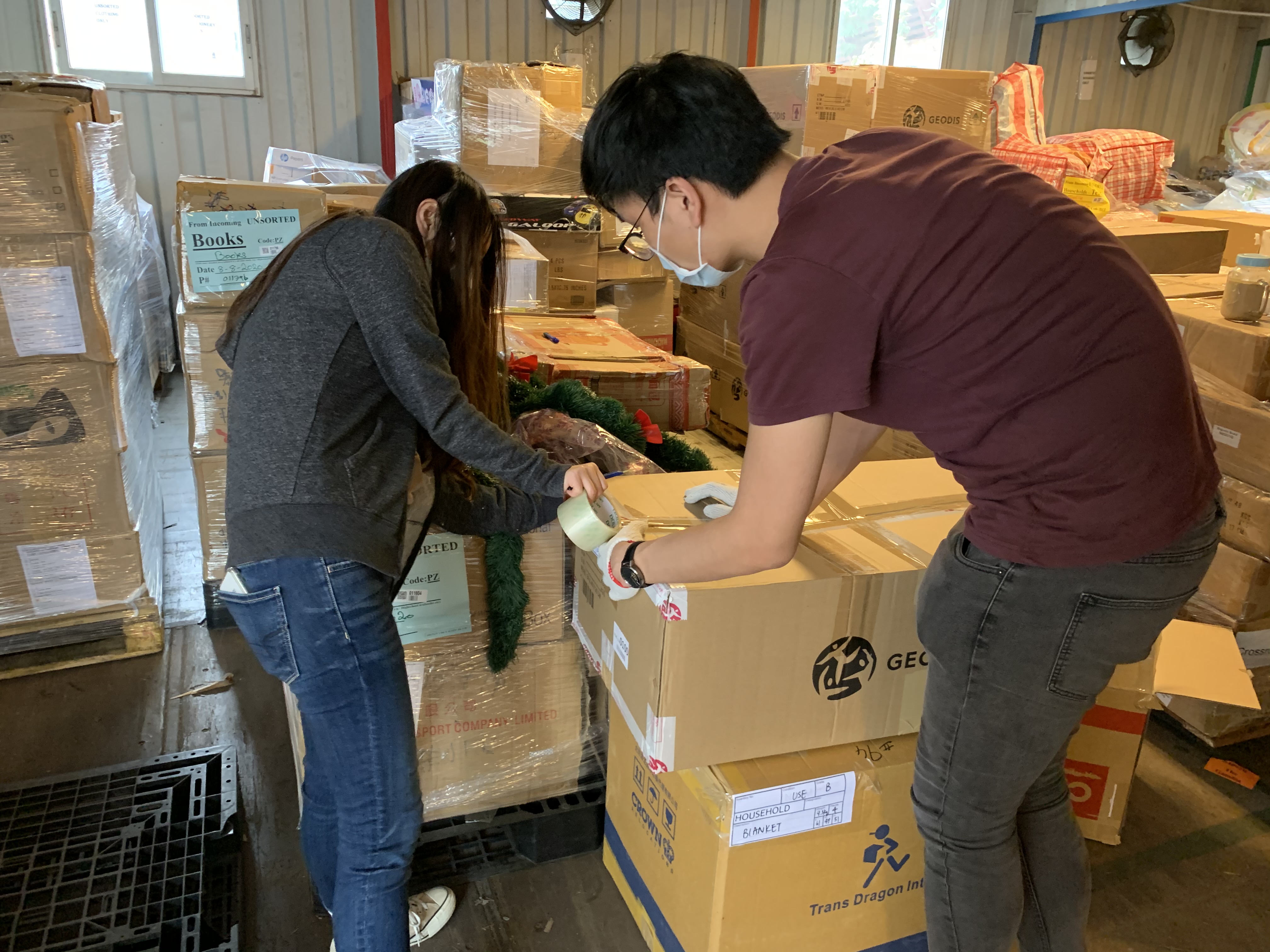 Volunteers packing the donations of goods