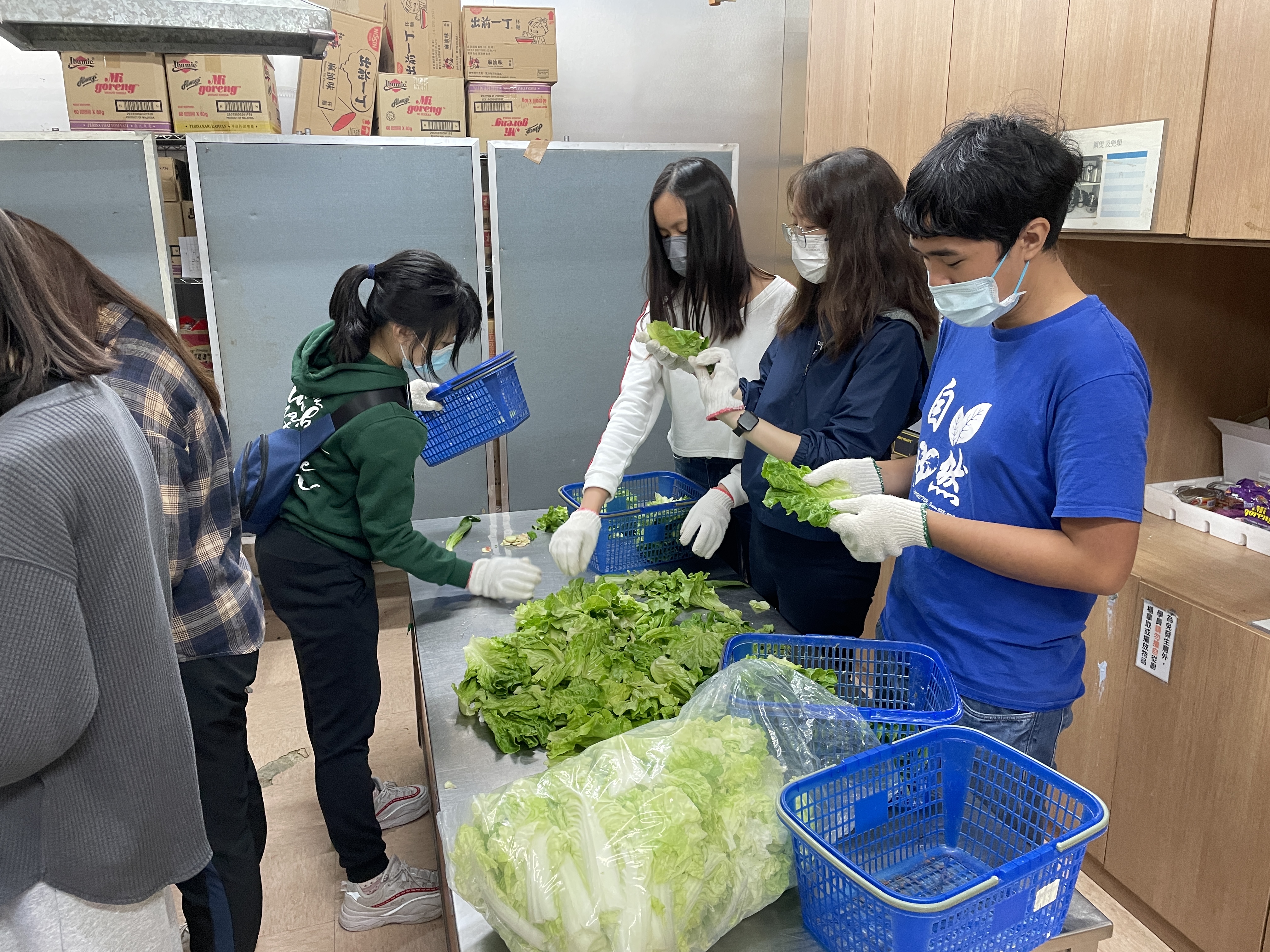 Volunteers are selecting good quality food.