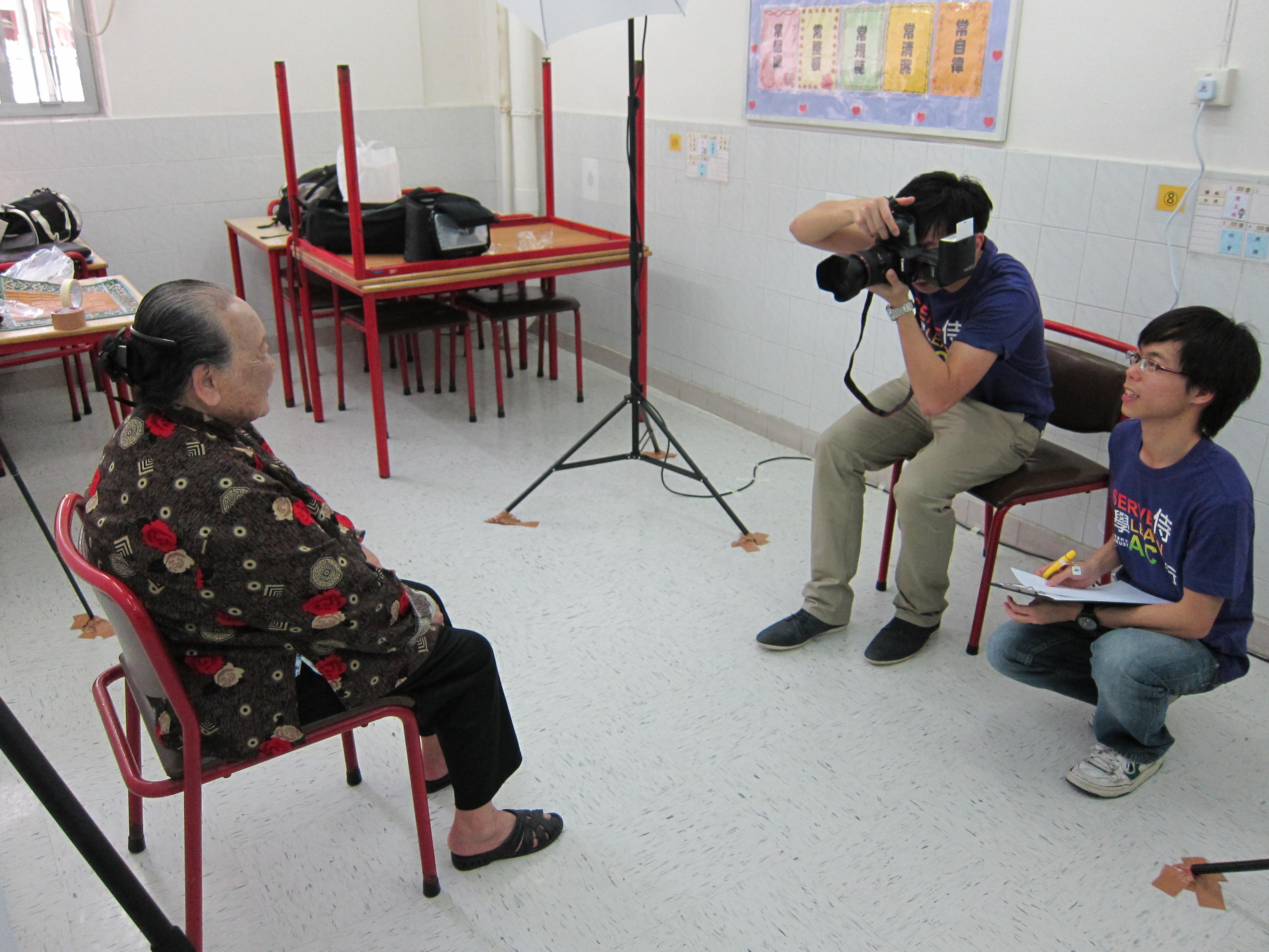 volunteers taking photos for older people
