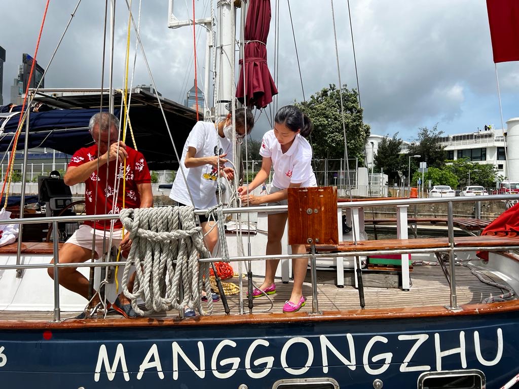 students serving on the yacht