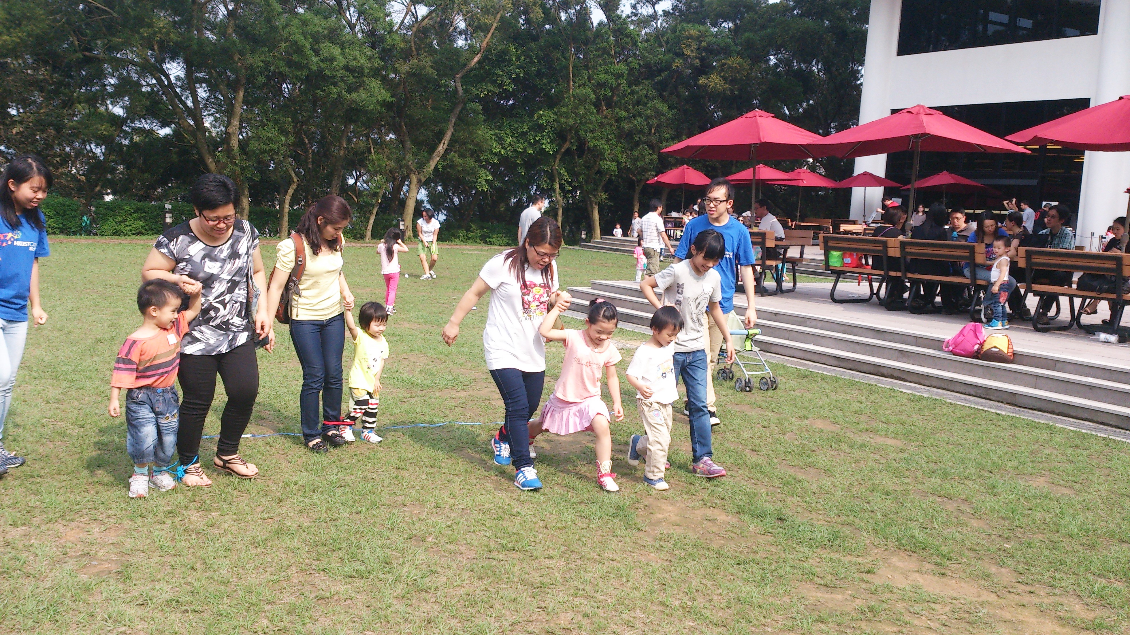 Children playing games with their parents in HKUST Campus