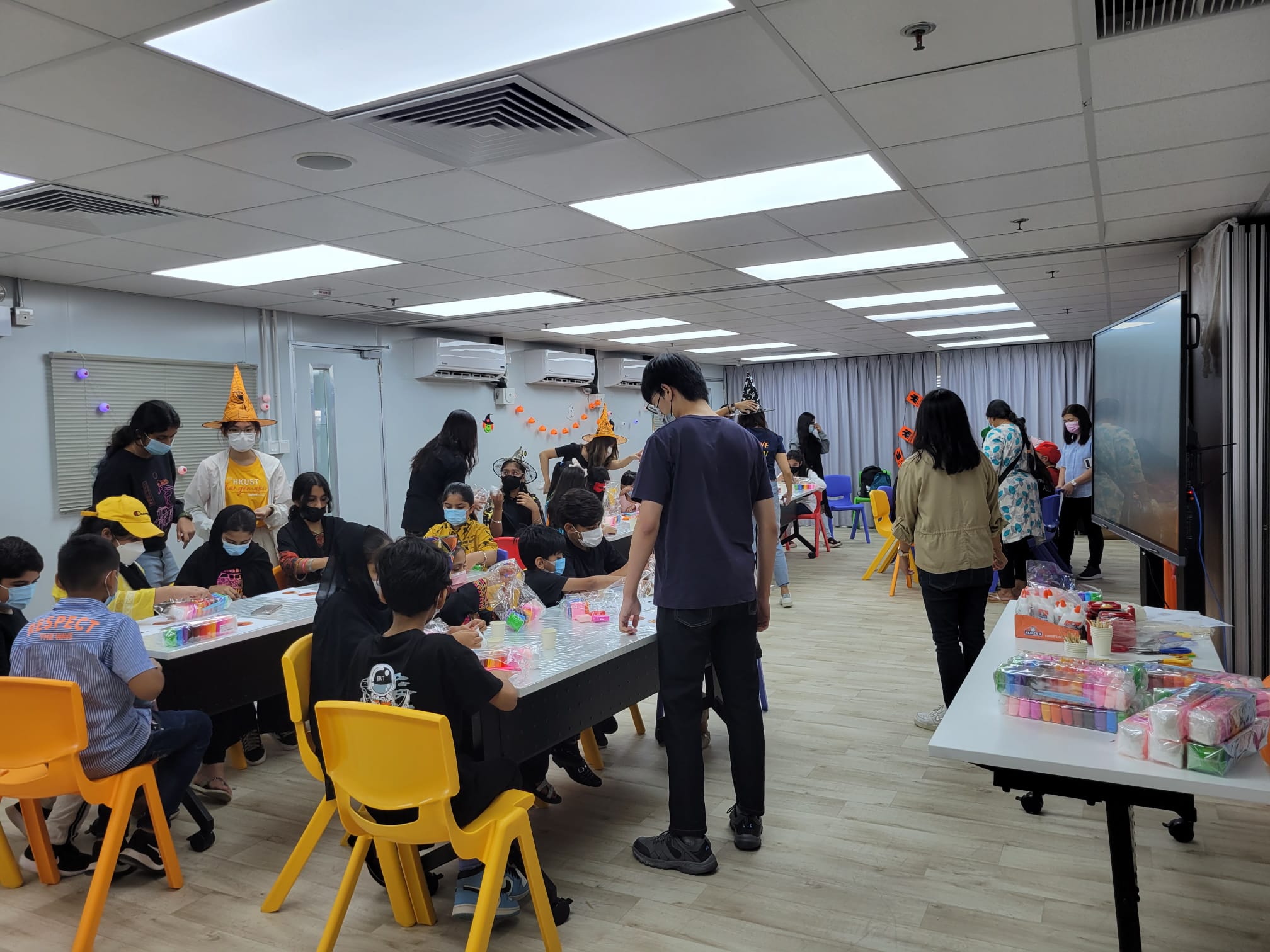 Volunteers having fun with EM kids