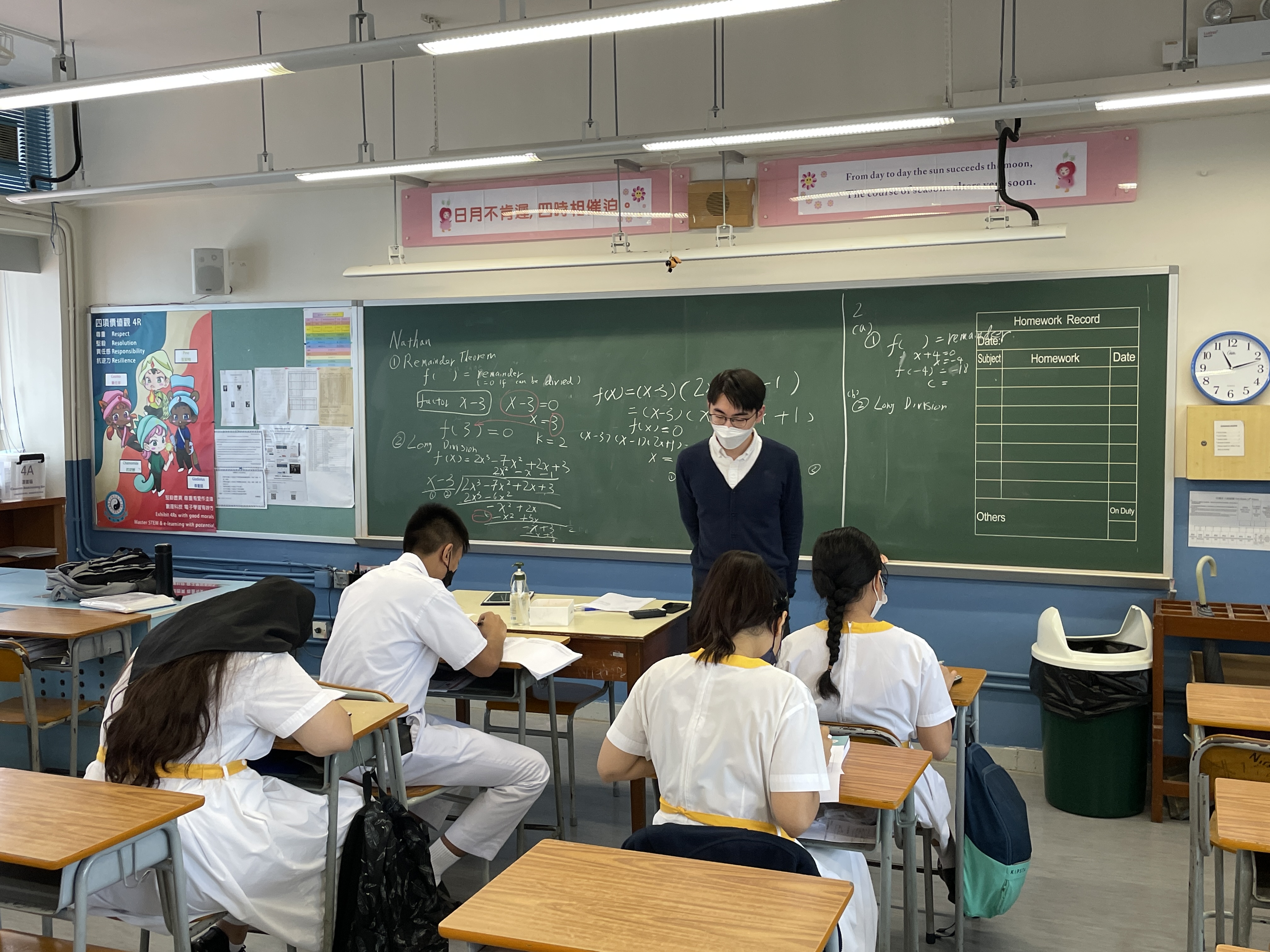 Volunteer teaching secondary school students.