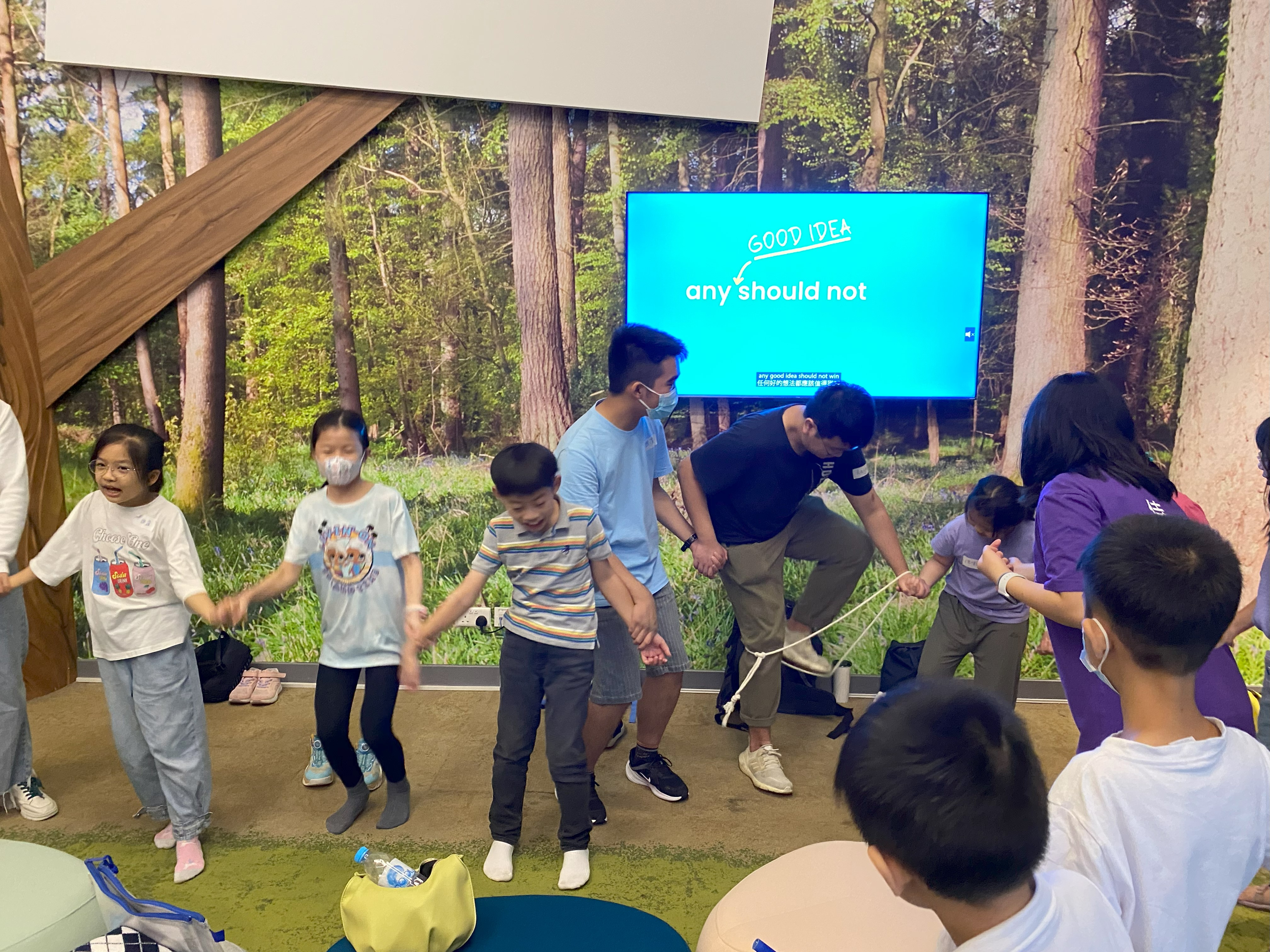 Volunteers playing checkpoint game with children
