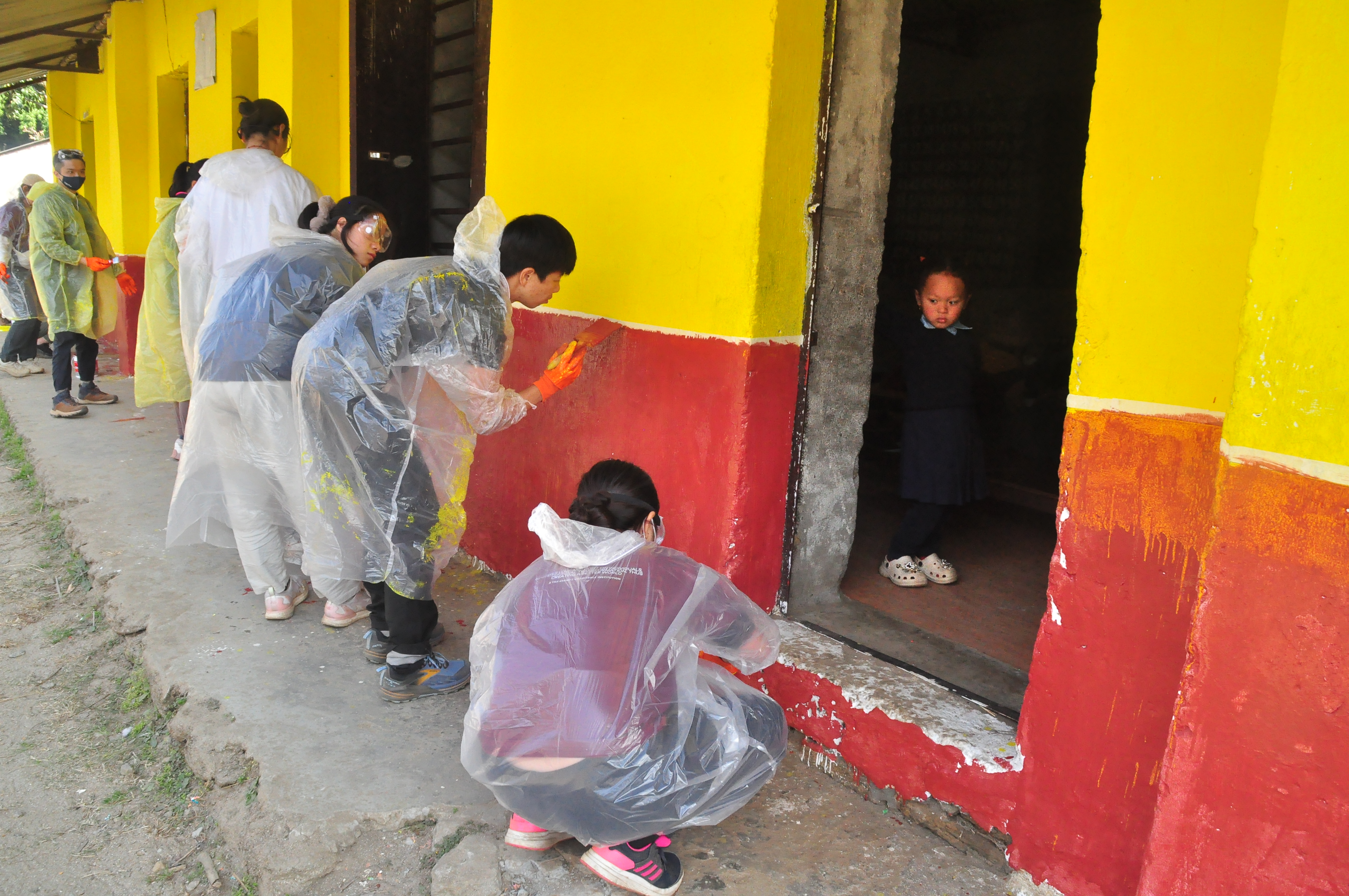 Painting the wall of the school