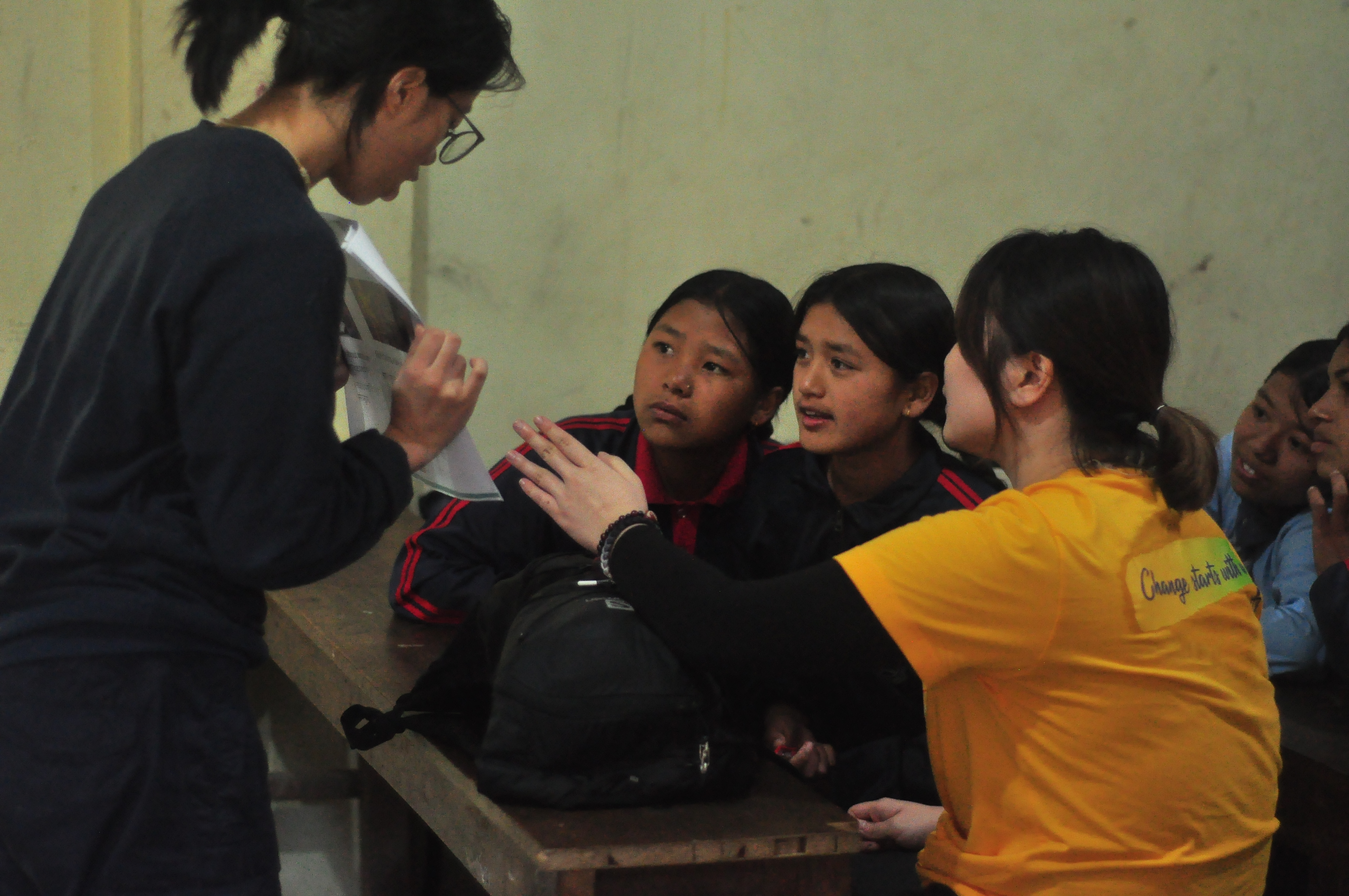 Volunteers teaching students