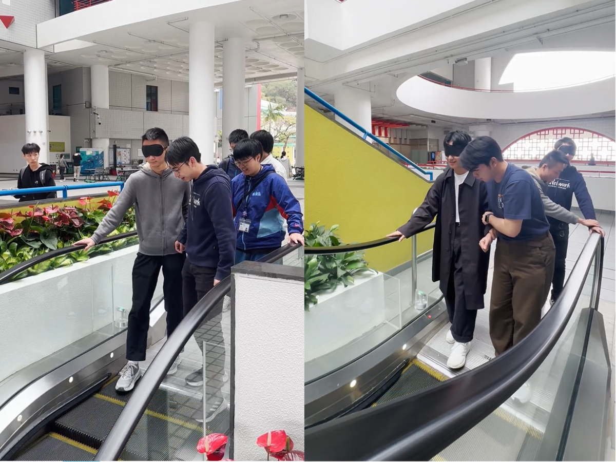 Blindfolded students taking the escalator with their partners