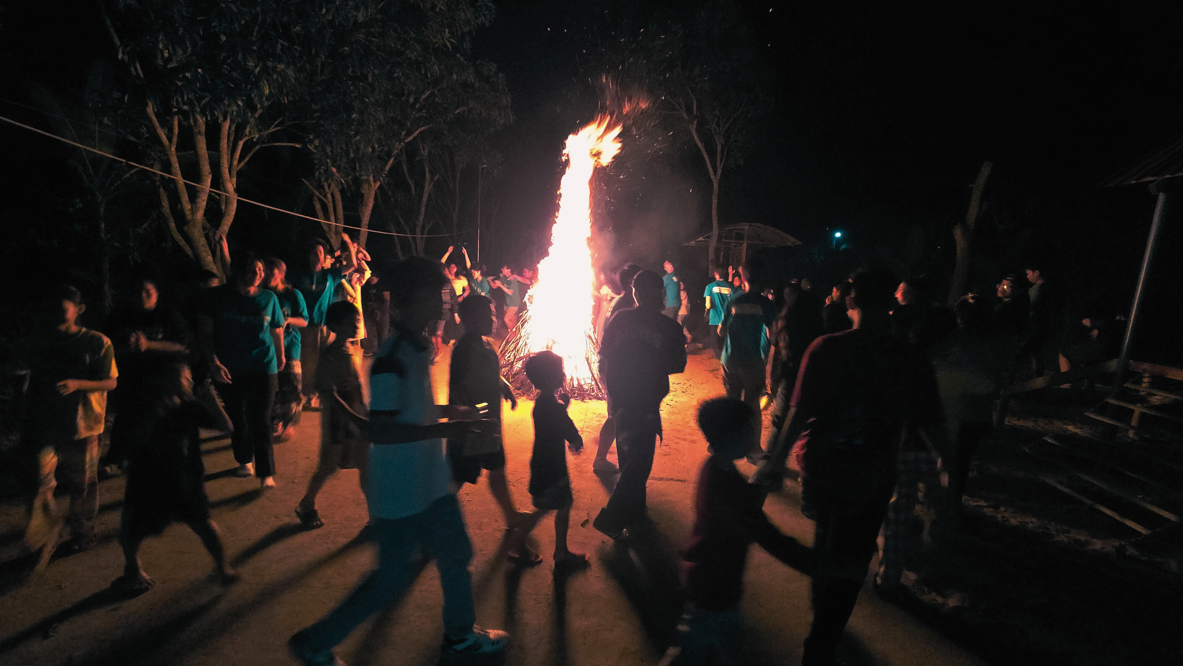 Having campfire with the local youth