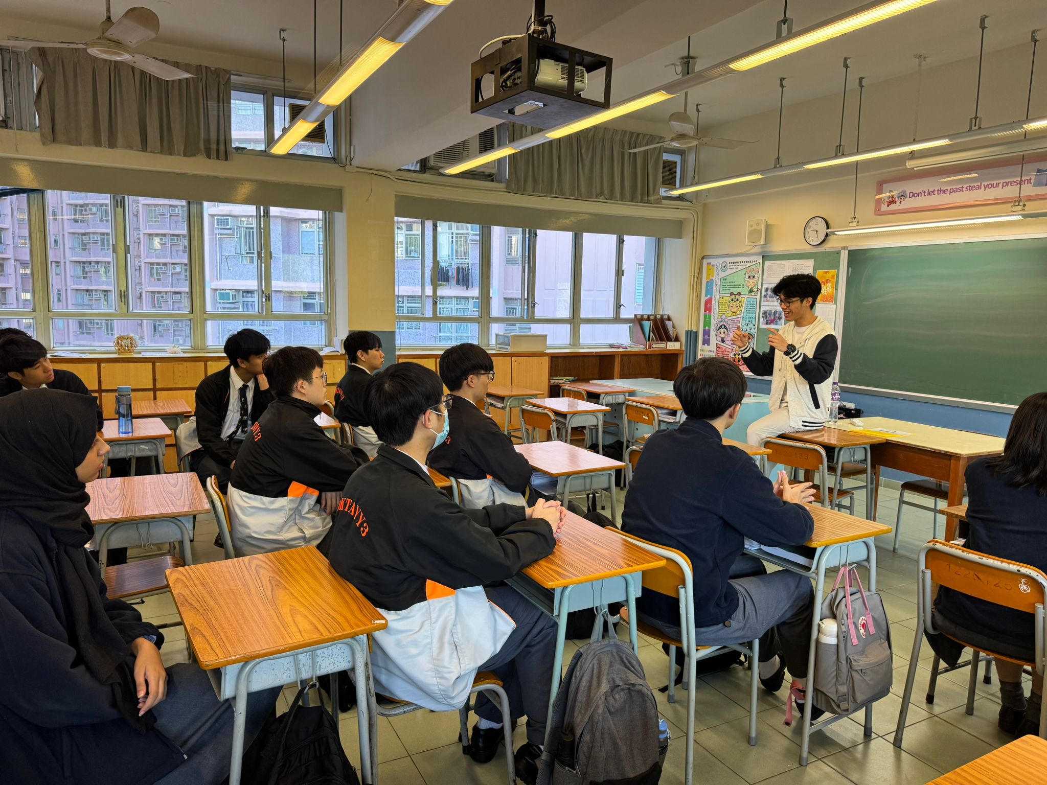 Volunteer sharing his views with secondary students