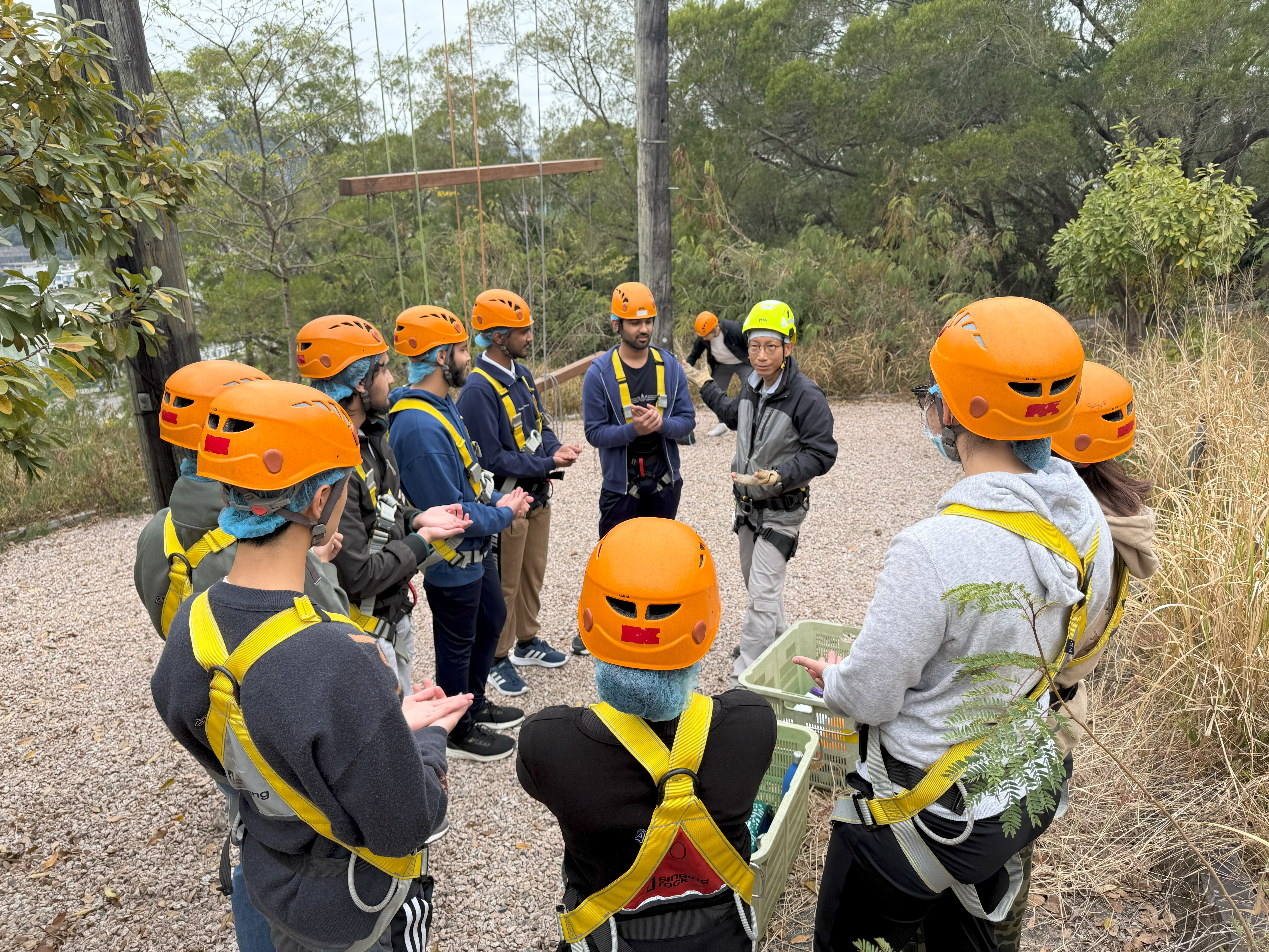 Students preparing for adventure in a team brief before the challenge ahead