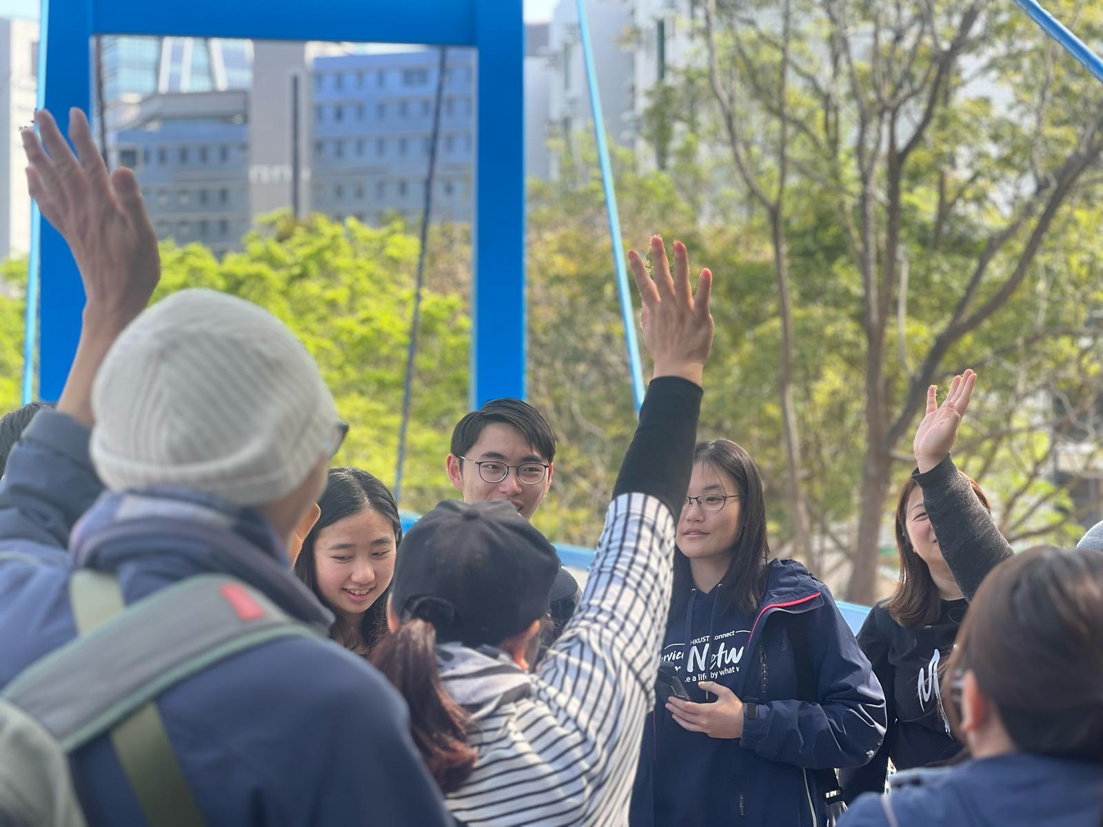 Volunteers guiding VIPs in a campus tour filled with multi-sensory elements