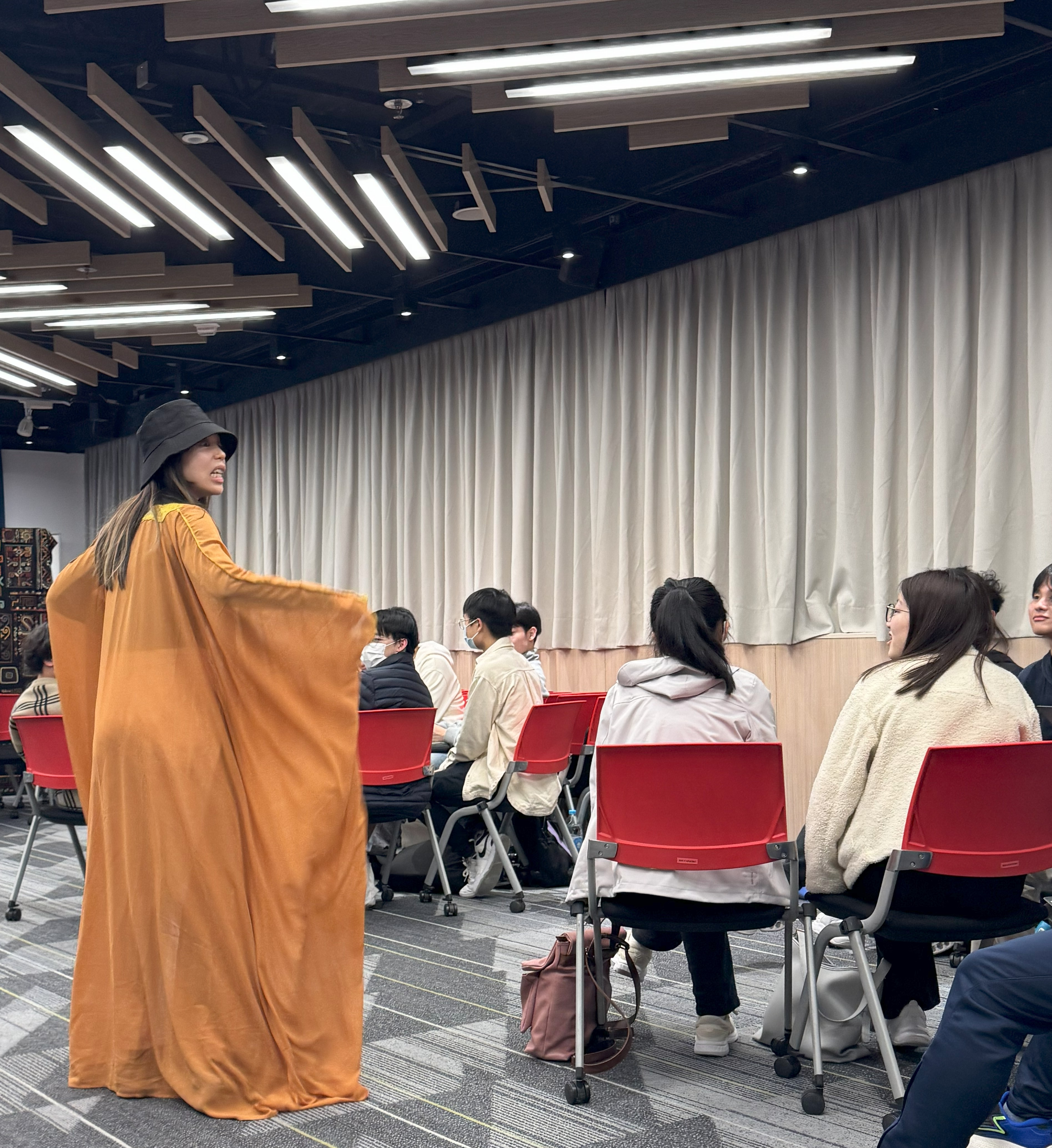 The host dressing up and acting as different characters to create an immersive experience for participants