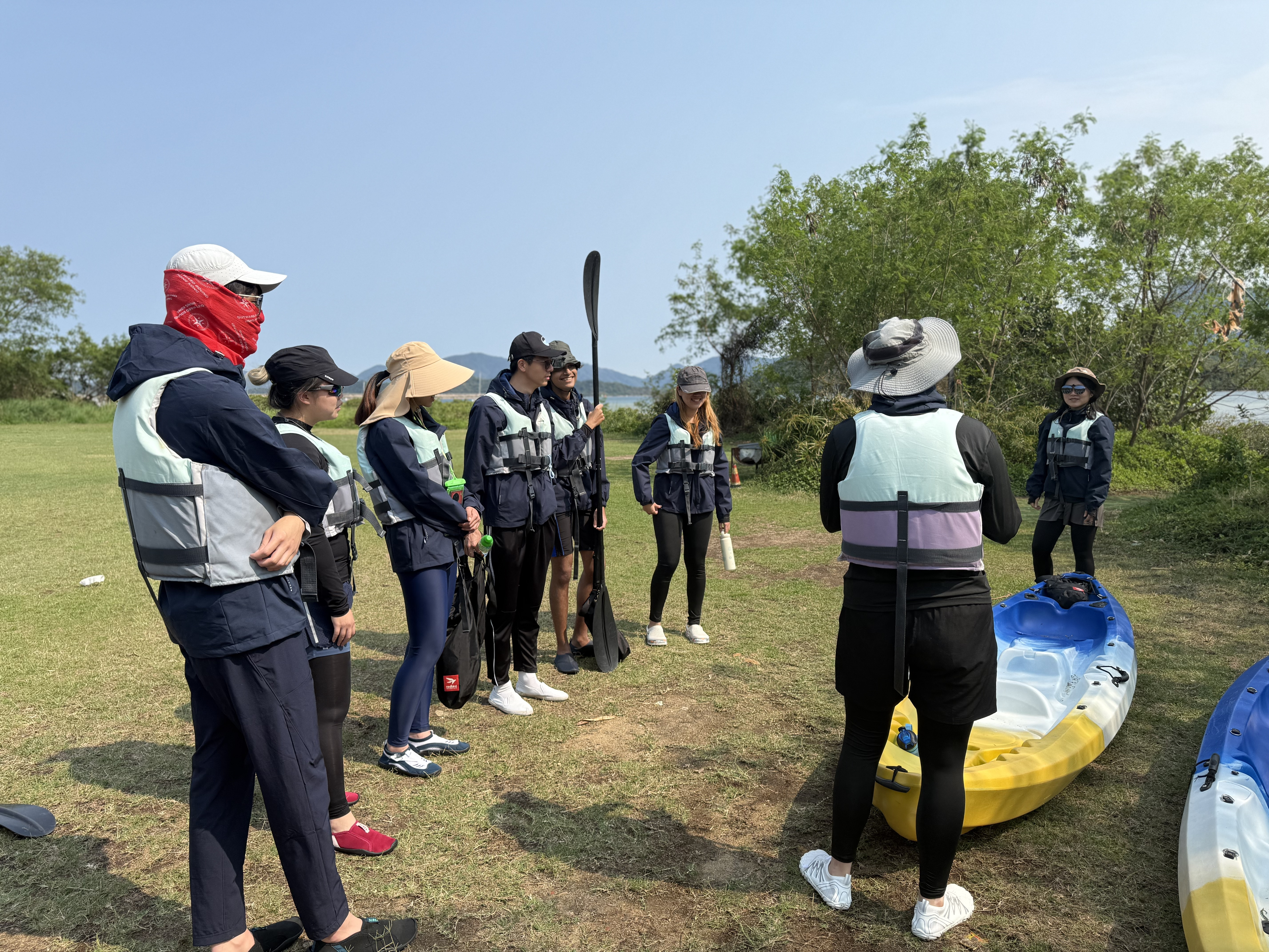 Demonstrating kayak activities with fellow students