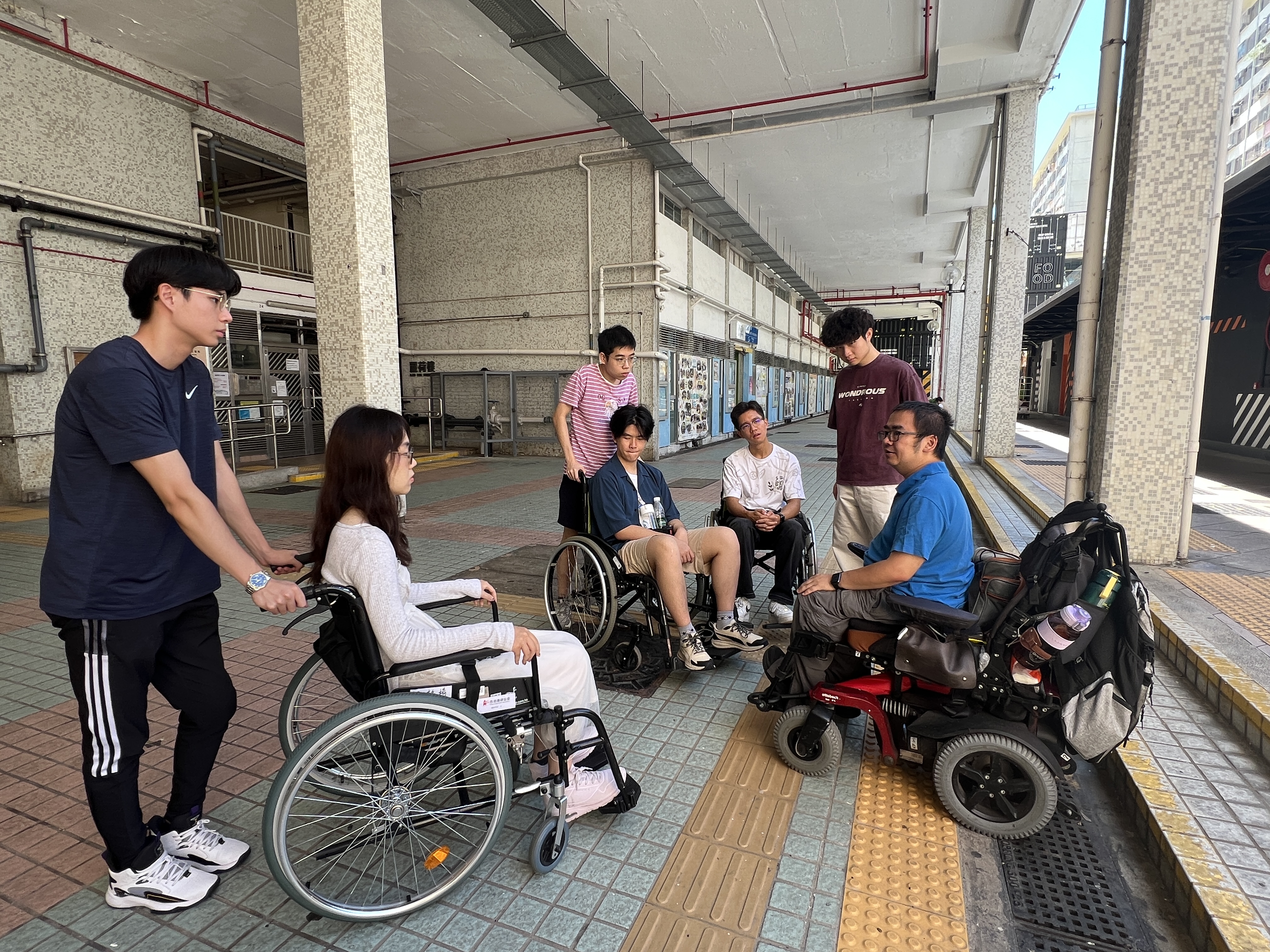 Students exploring the community in wheelchairs