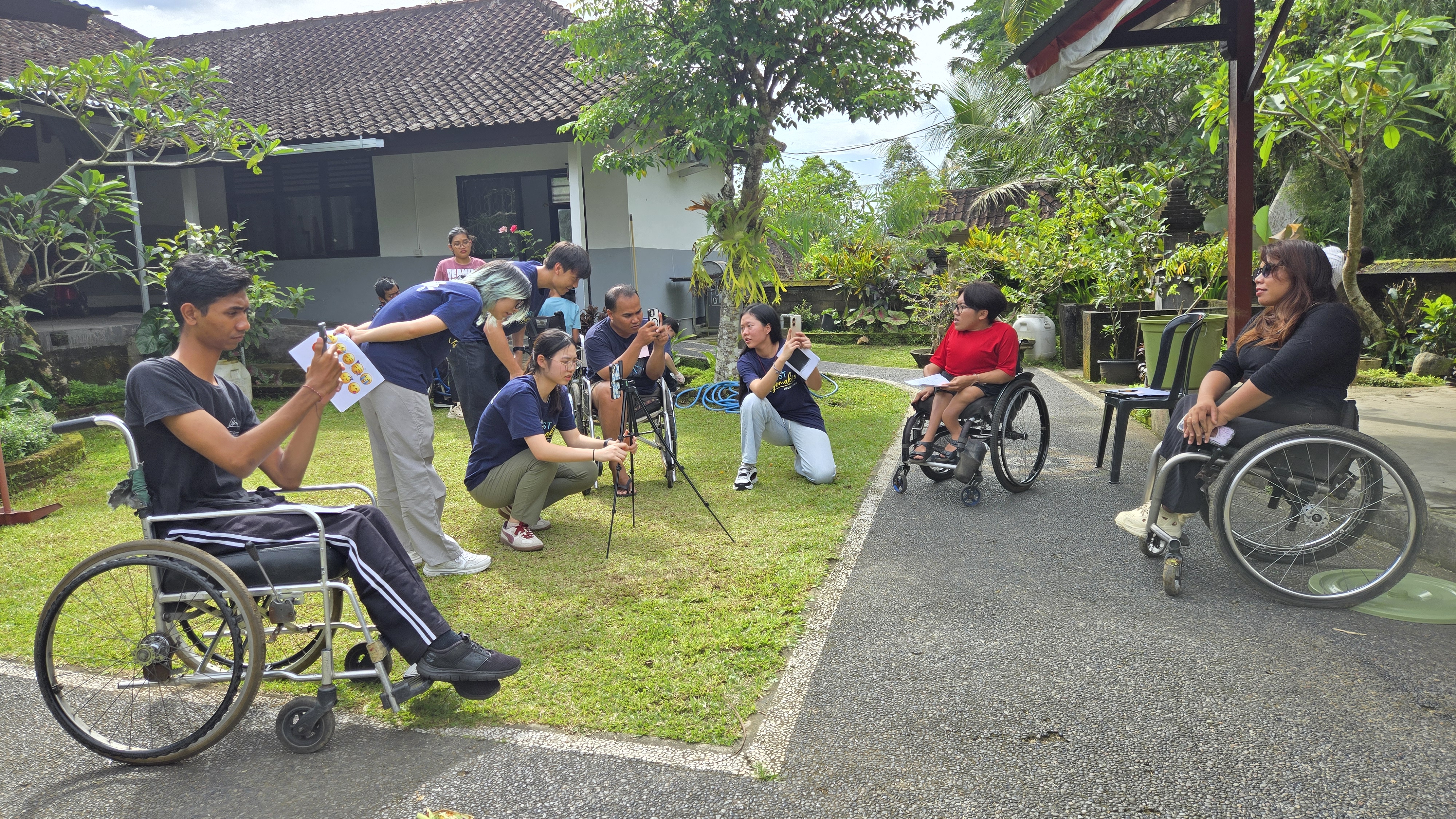 Volunteers co-creating short videos with individuals with physical disabilities