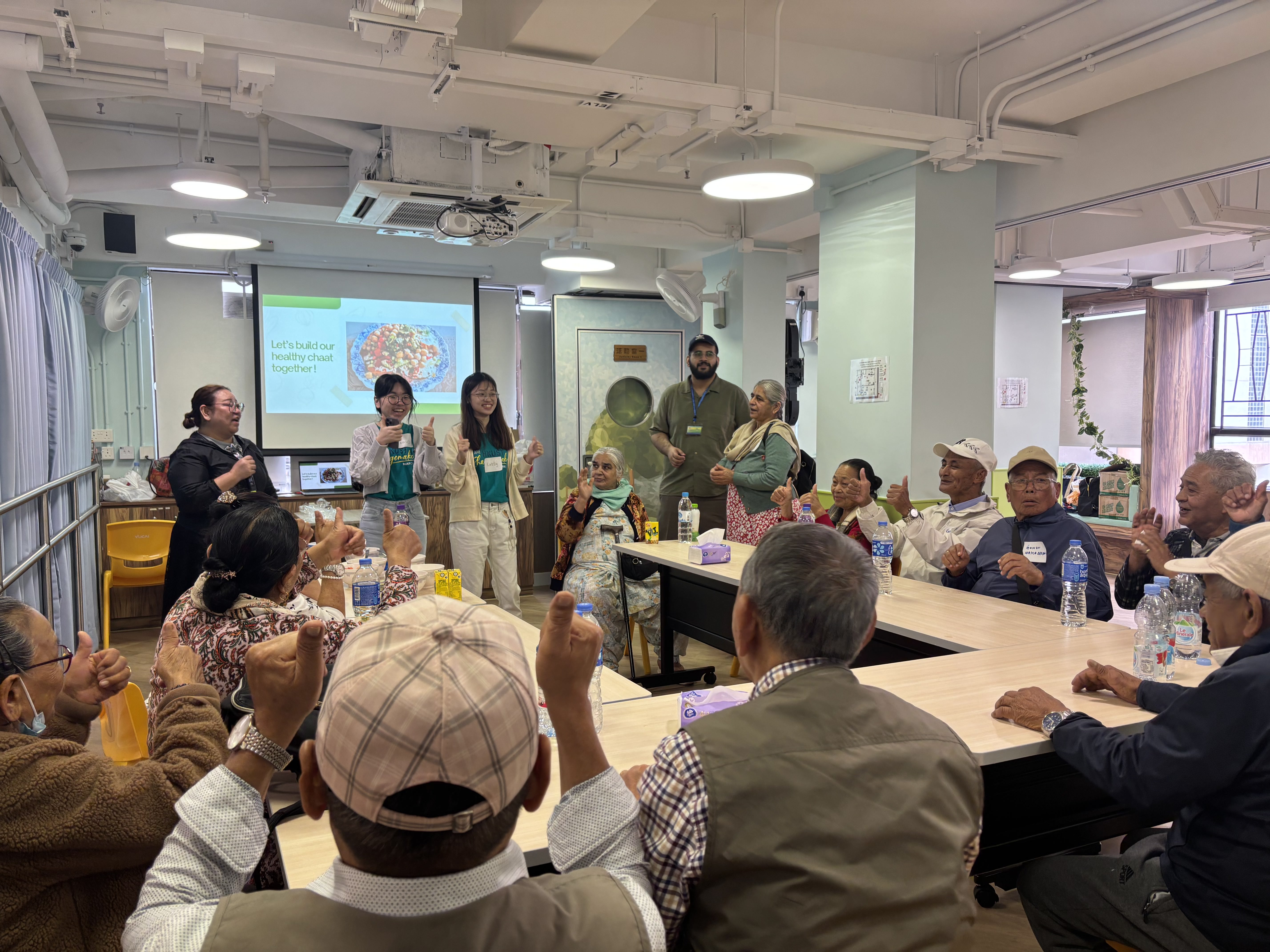 Students sharing healthier food choices with the elderly
