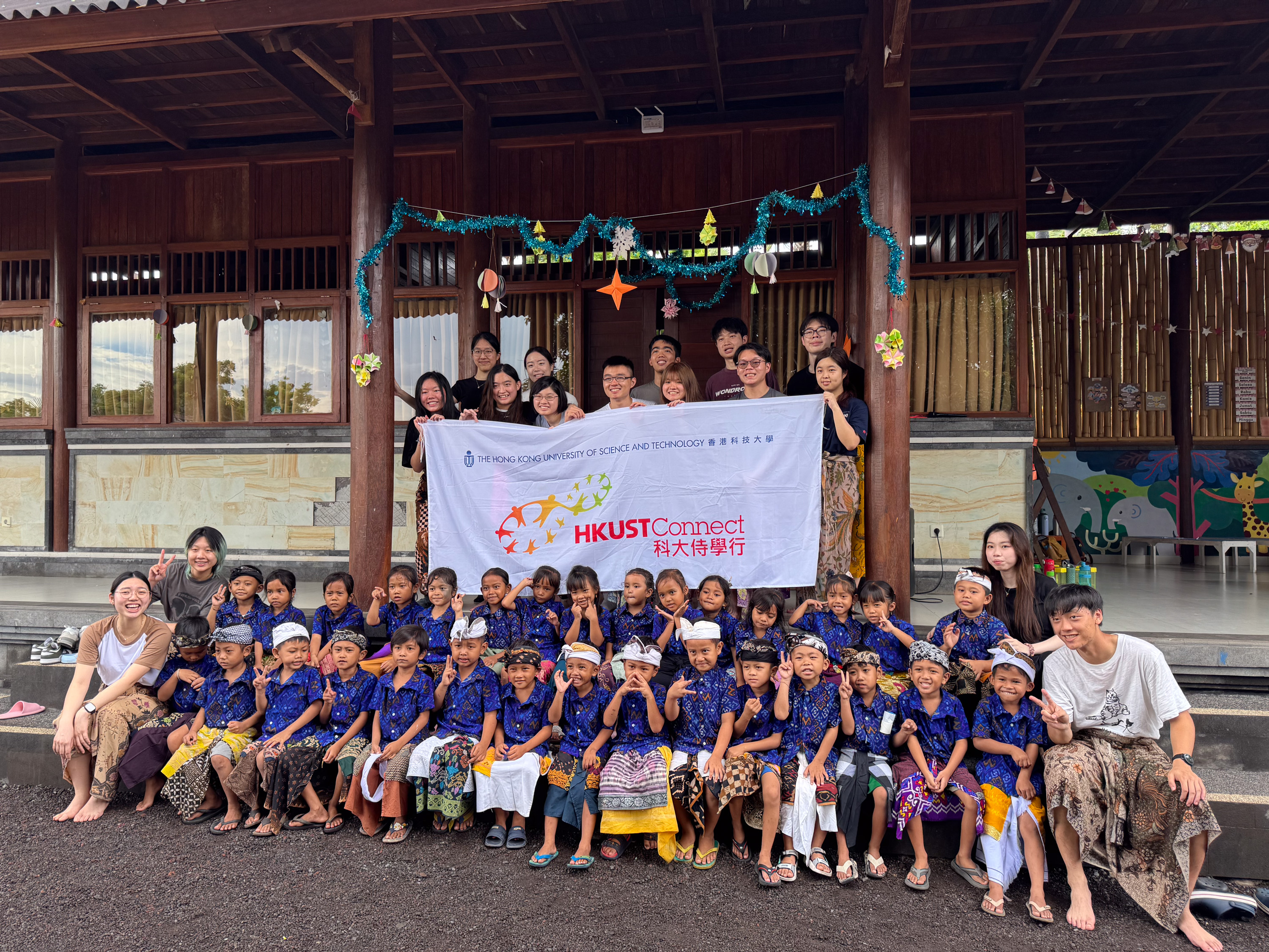 Volunteers serving kindergarten students at Suwandi Foundation