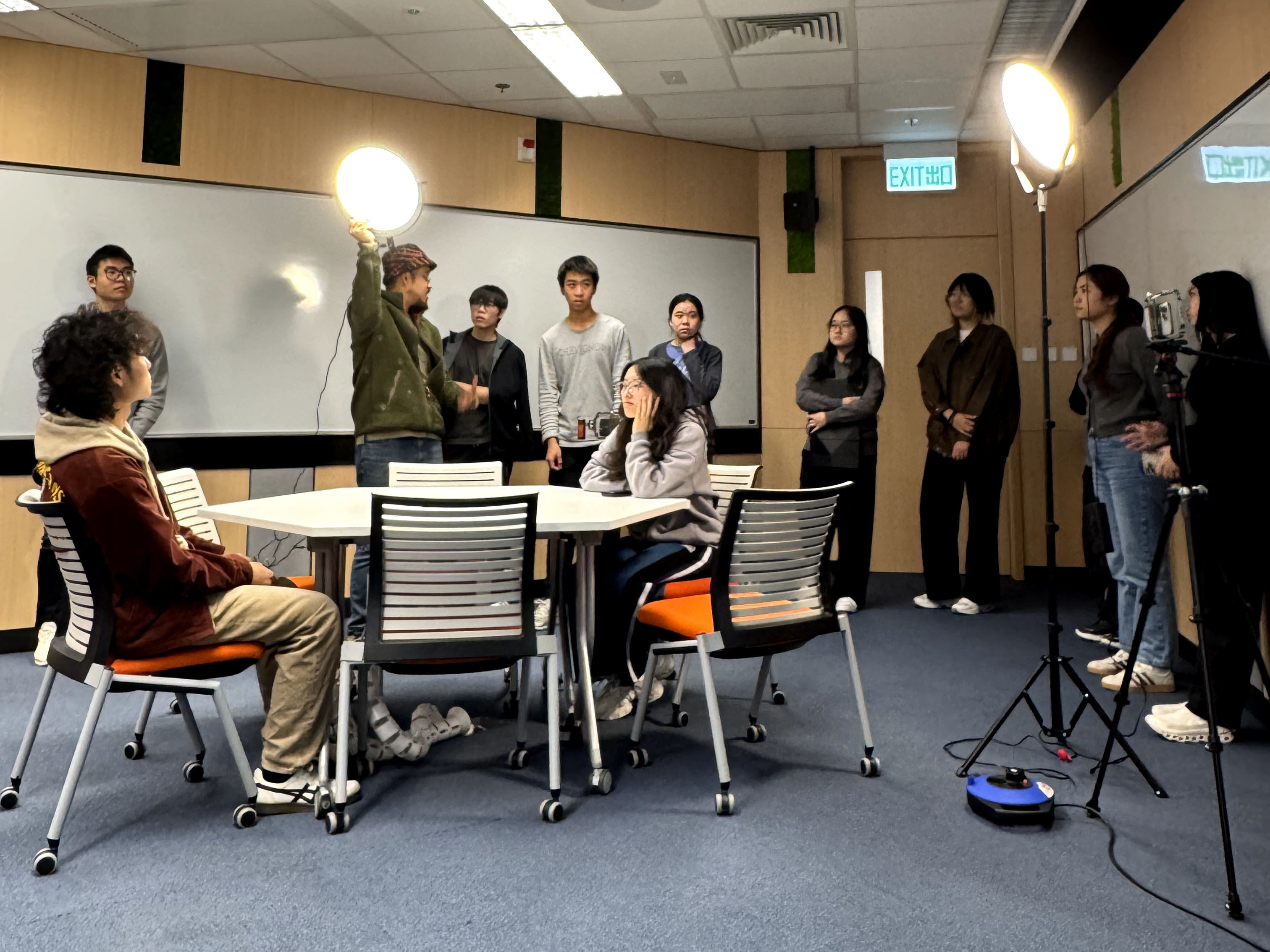 Participants learning how to properly set up lighting equipment
