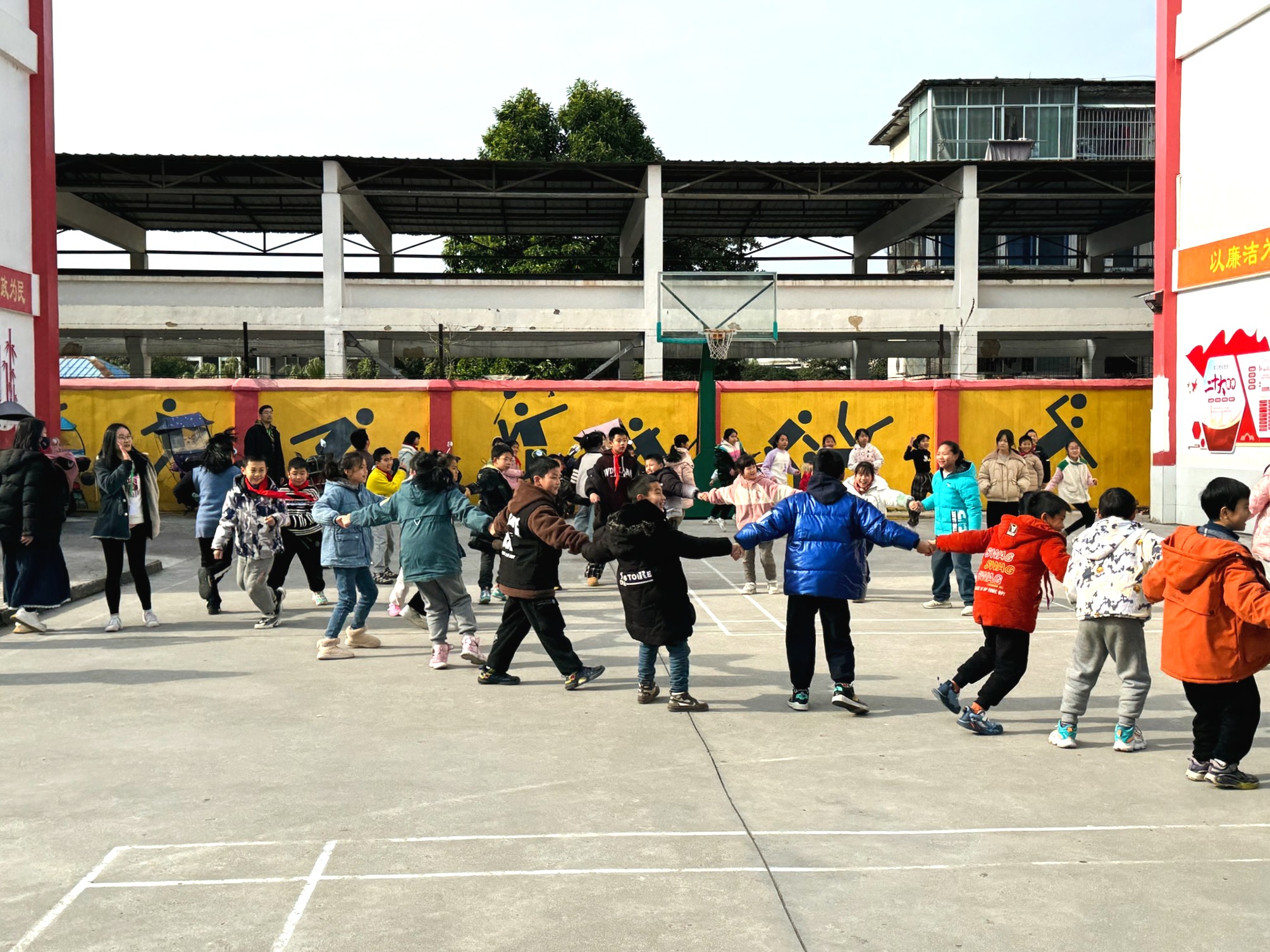 Volunteers and kids building bonds through games.