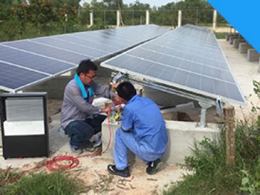 Technician installing the solar panels in Cambodia.