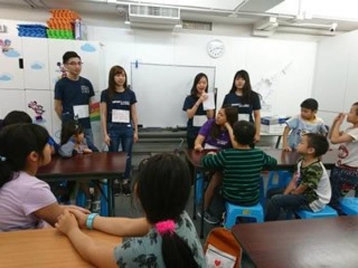 Volunteers introducing the children some writing tips