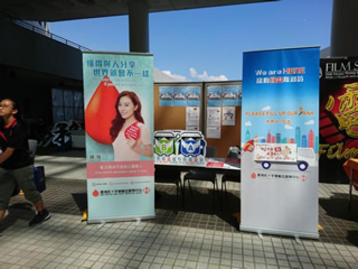 Volunteers setting up the promotional counter at the atrium