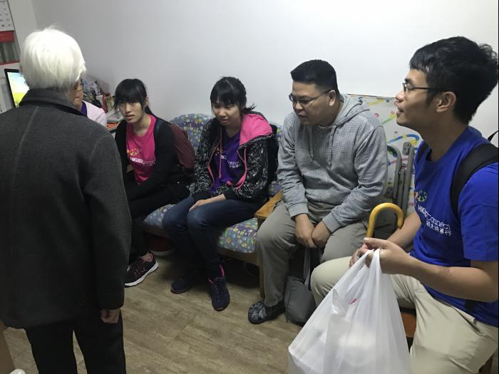 Volunteers chatting with elders