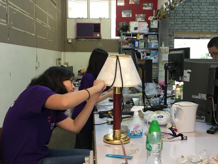 Checking if the lamp is working before sending it to people in need