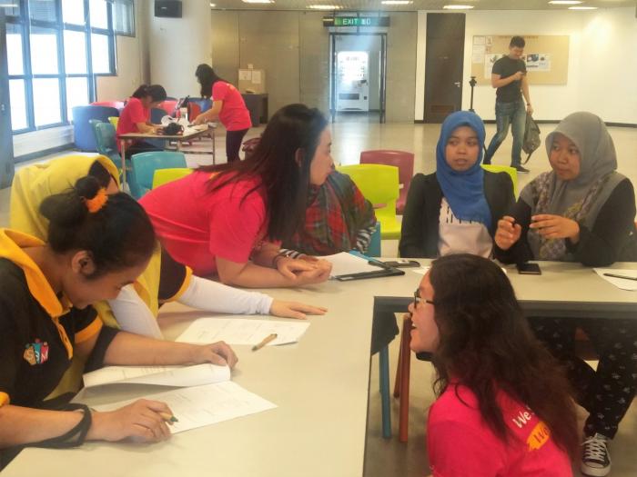 Volunteers teaching the workers some business skills