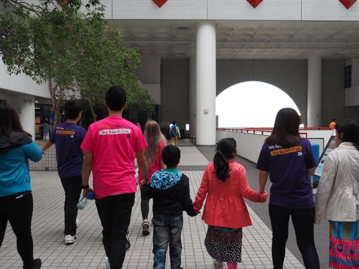 Volunteers leading a HKUST Campus tour to recipients