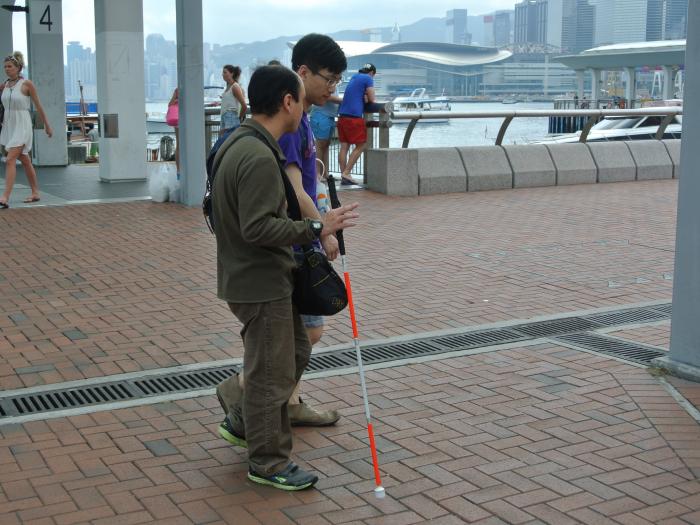 Volunteer leading a VIP to explore a new place